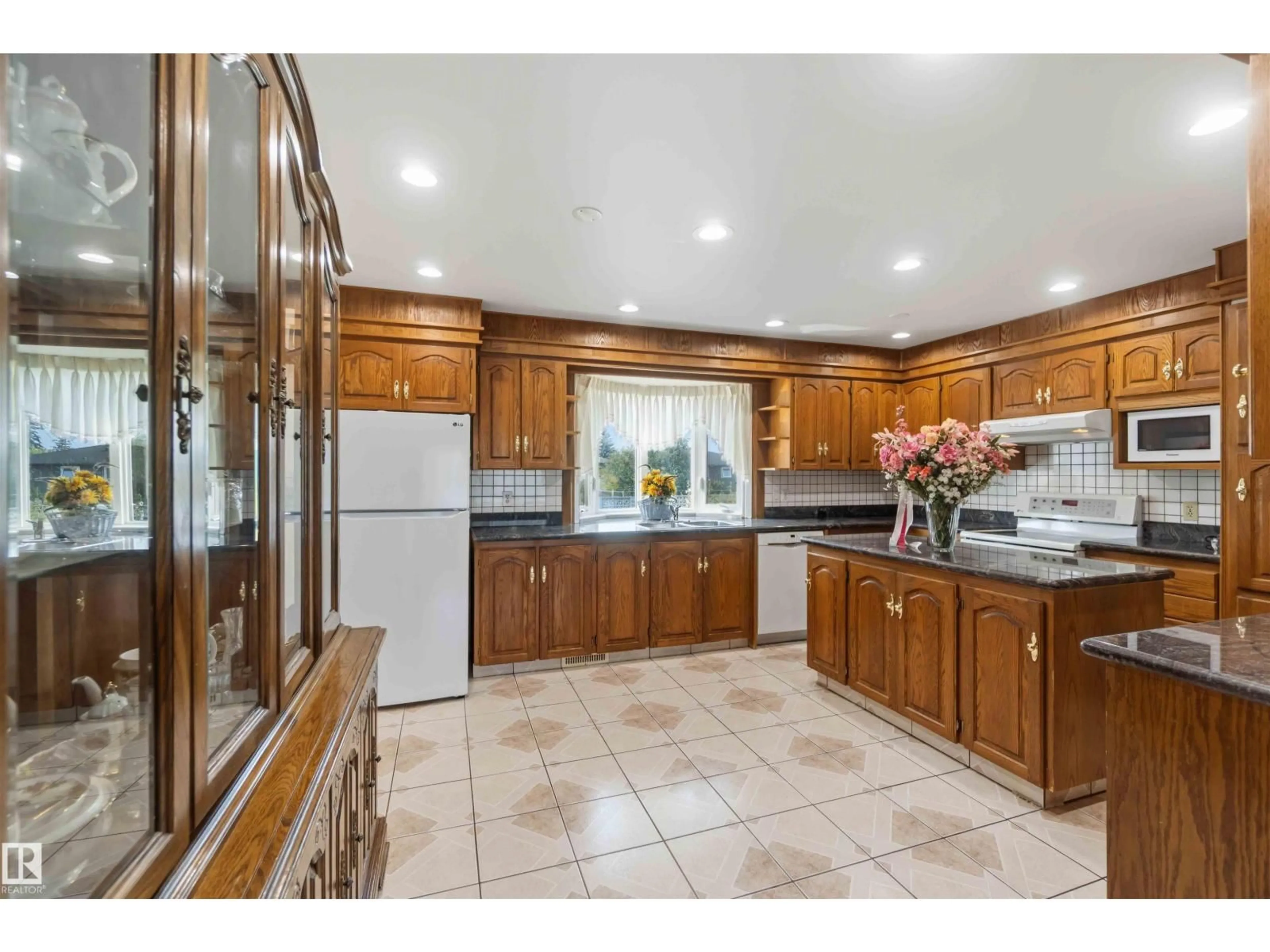 Open concept kitchen, ceramic/tile floor for 8031 135A AV, Edmonton Alberta T5C2J6