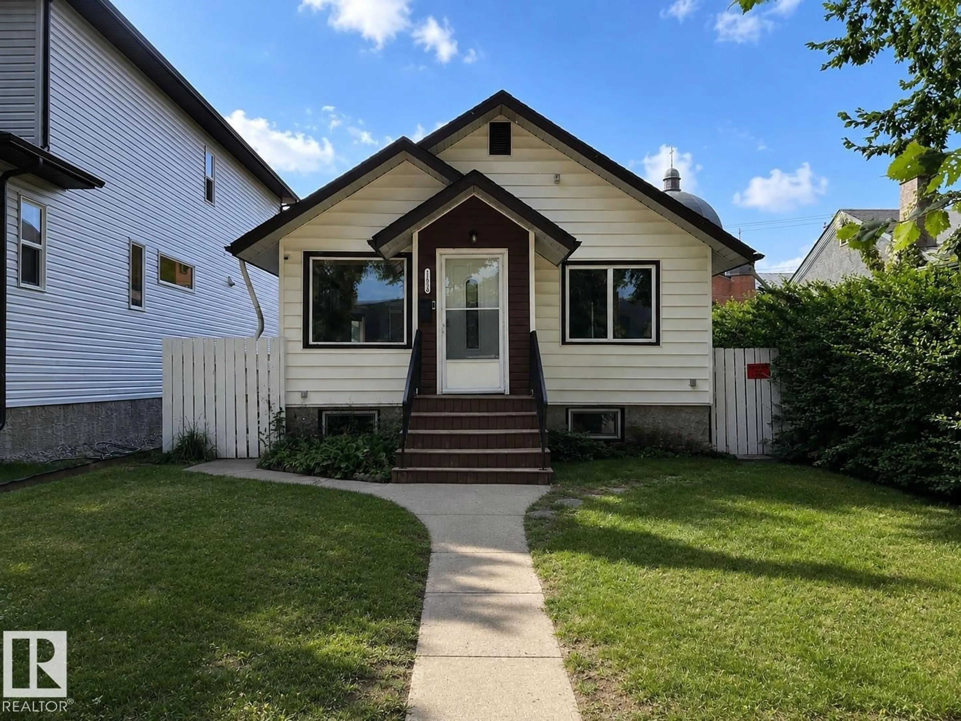 Home with vinyl exterior material, street for NW - 11934 64 ST, Edmonton Alberta T5W4J3