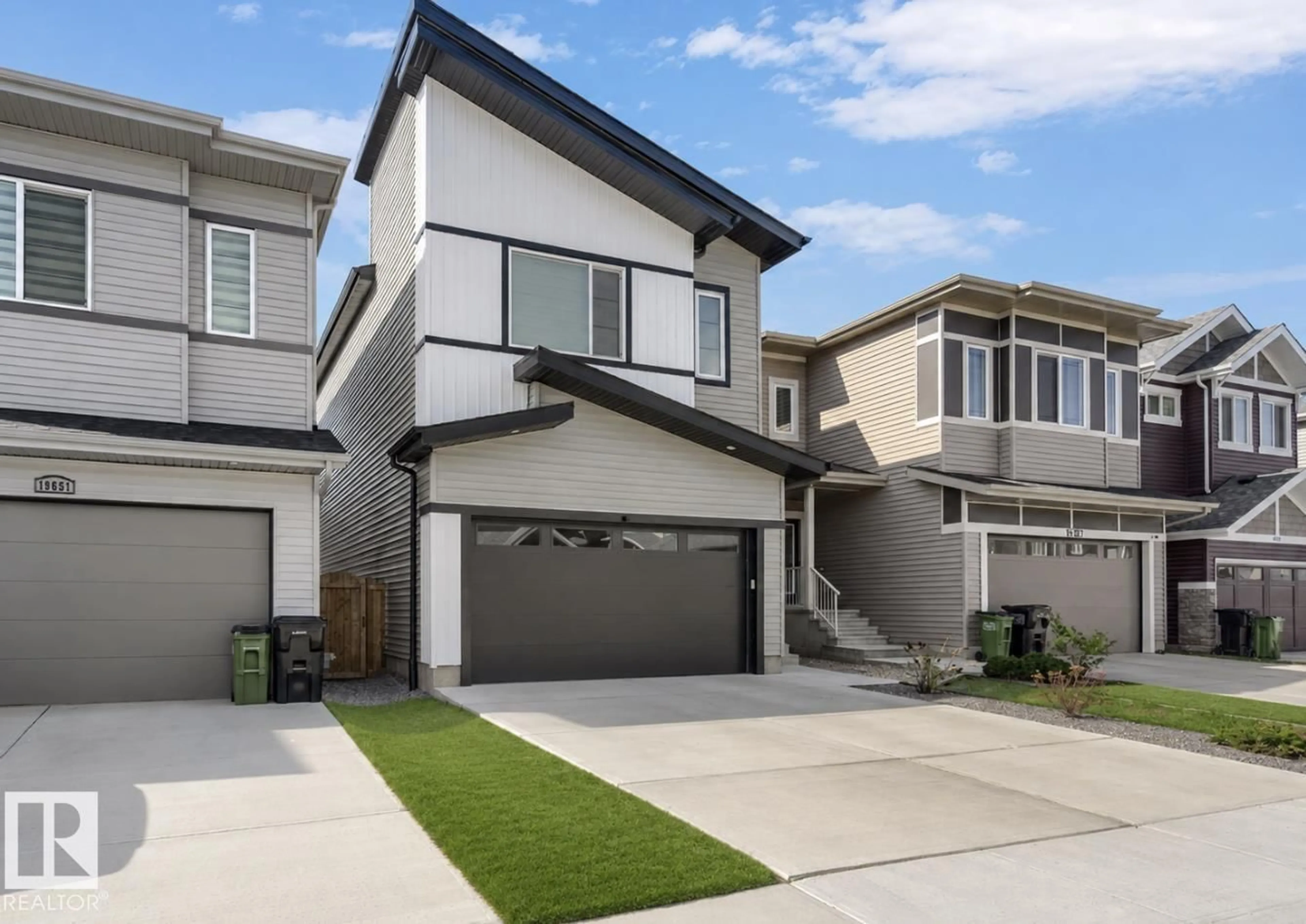 Home with vinyl exterior material, street for 19703 29 AVENUE AVENUE, Edmonton Alberta T6M1M2