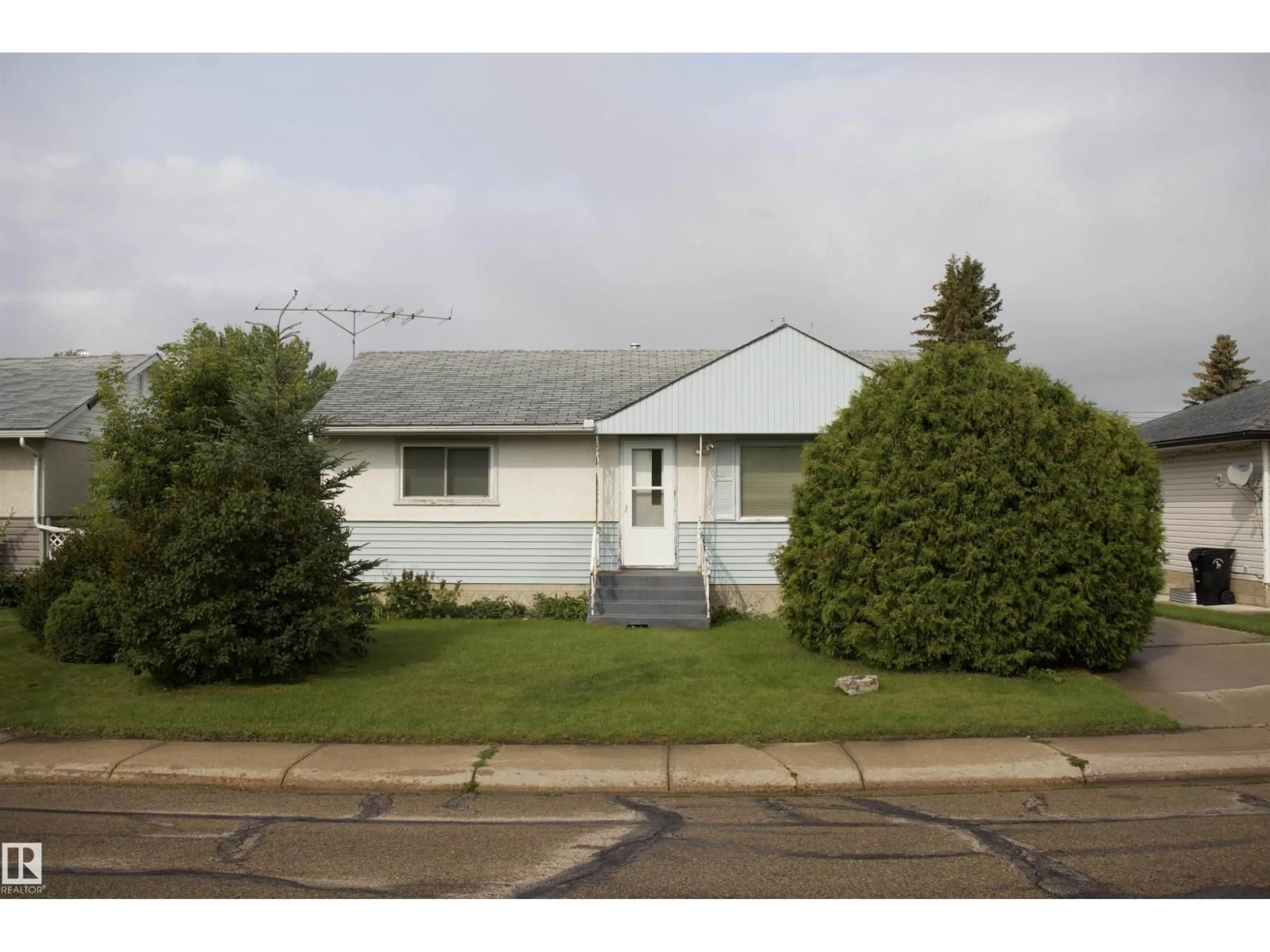 Home with vinyl exterior material, street for 4926 47 ST, Barrhead Alberta T7N1H6