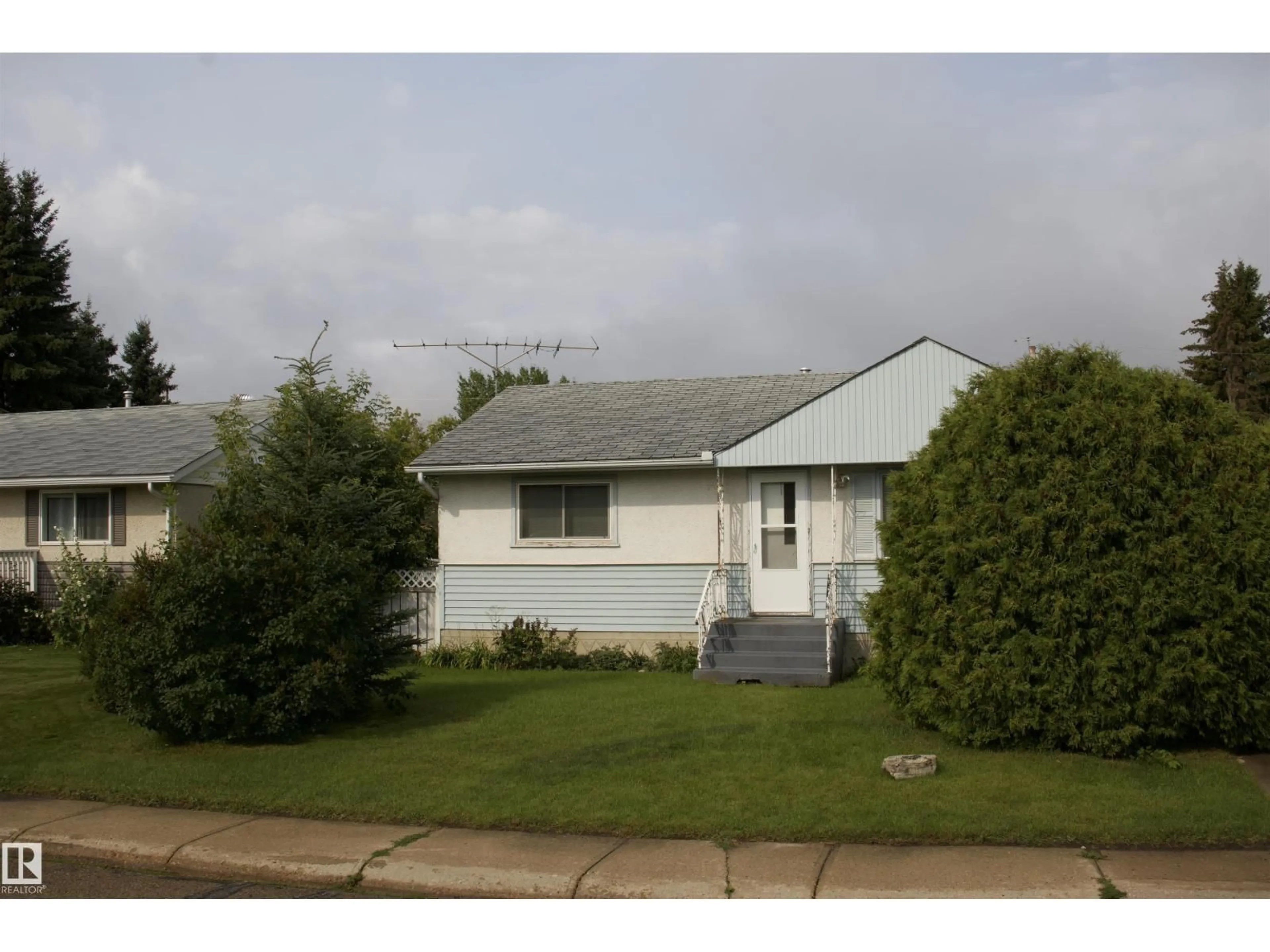 Home with vinyl exterior material, street for 4926 47 ST, Barrhead Alberta T7N1H6