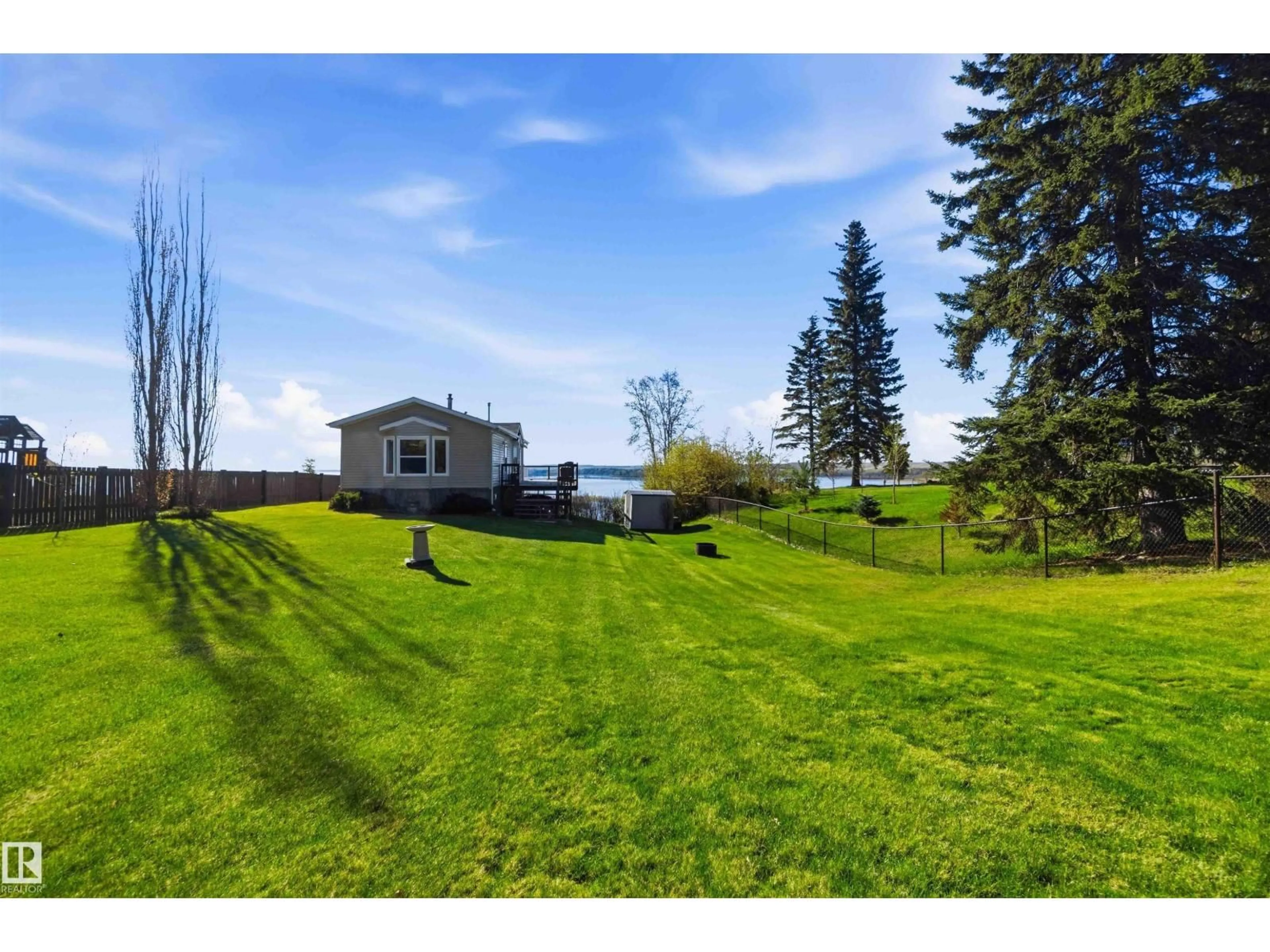 A pic from outside/outdoor area/front of a property/back of a property/a pic from drone, water/lake/river/ocean view for 53117 - 7 HWY 31, Rural Parkland County Alberta T0E2B0