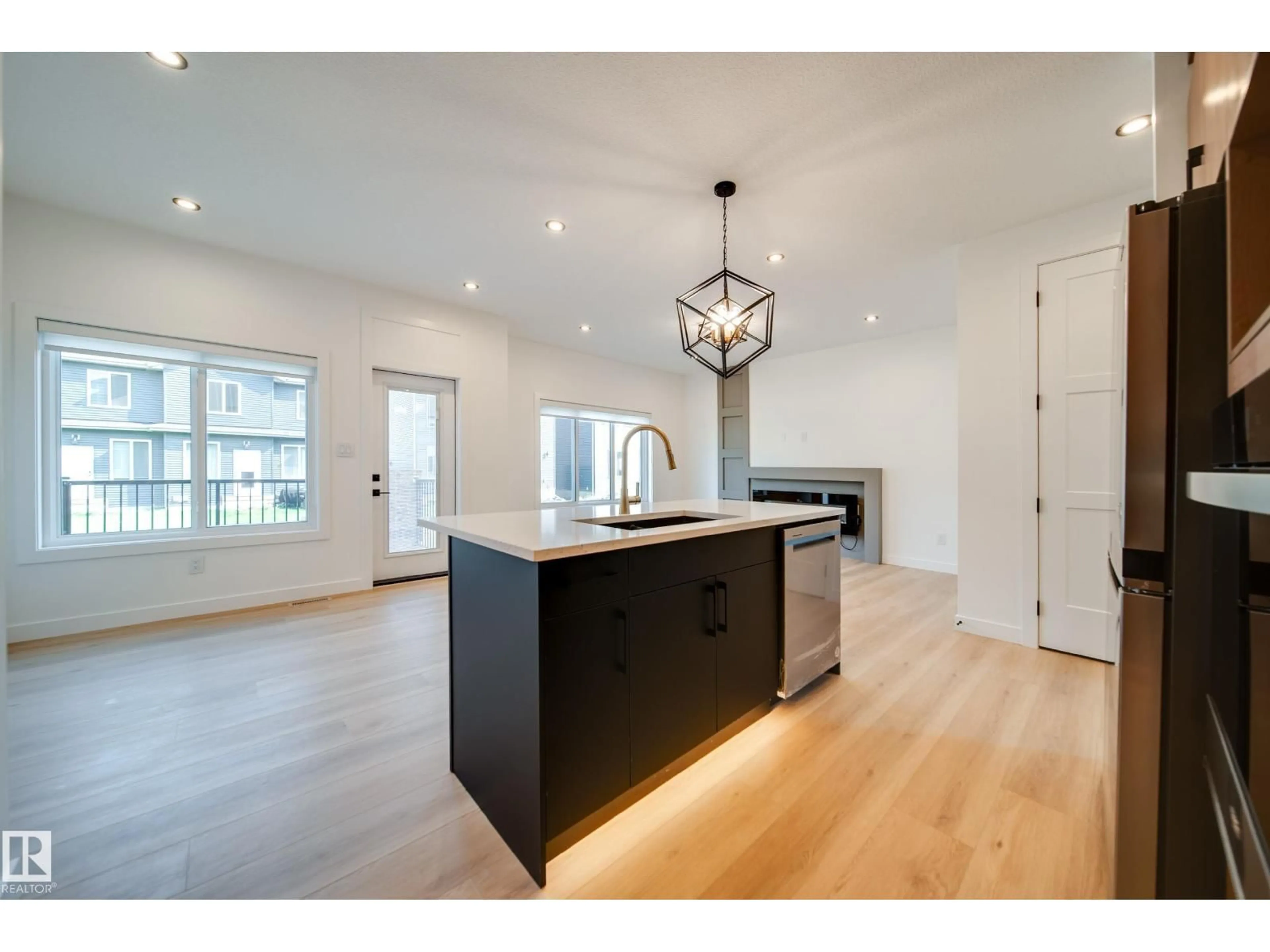 Open concept kitchen, wood/laminate floor for 10 BLACKBIRD BN, Fort Saskatchewan Alberta T8L0G6