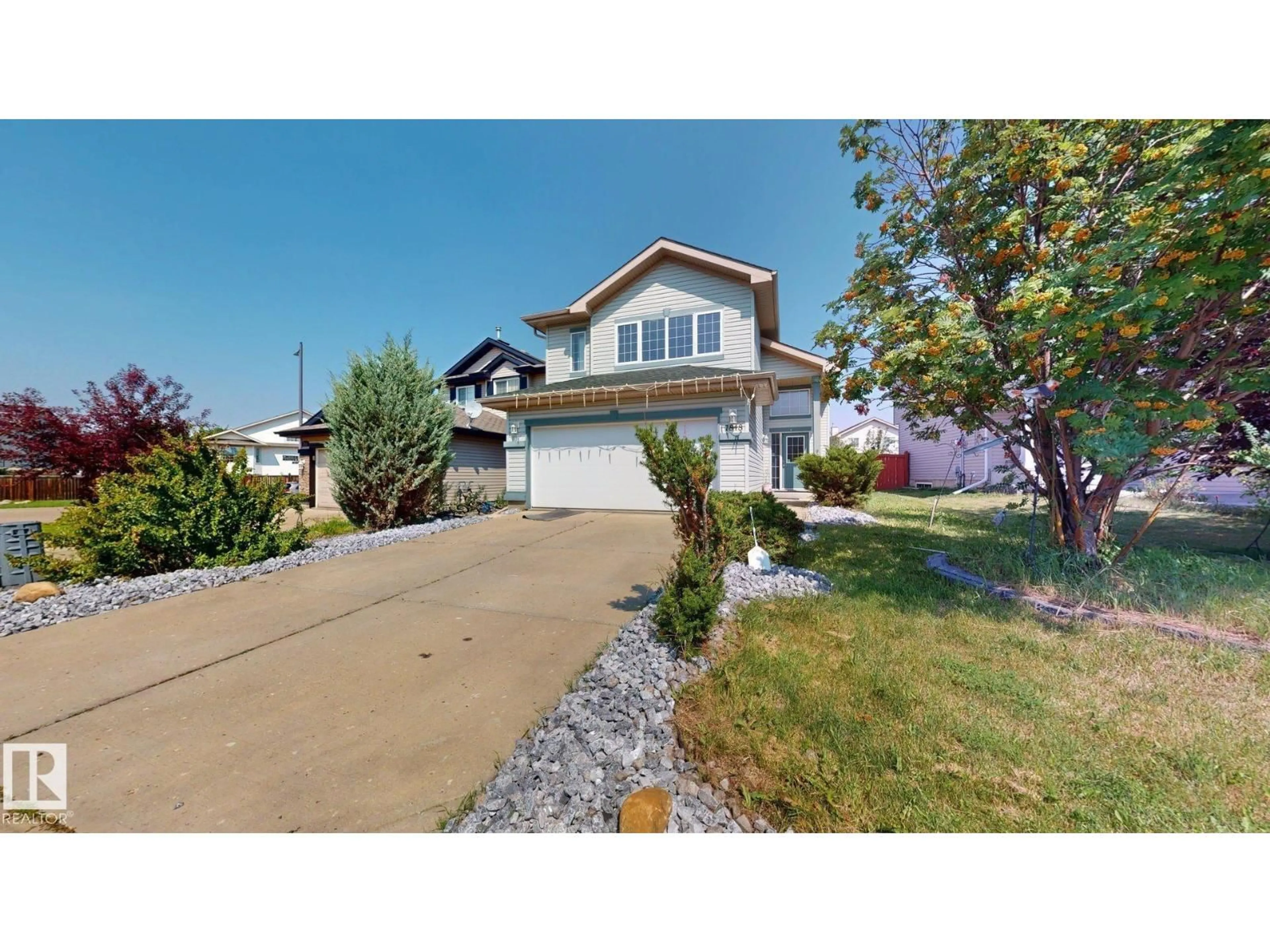 Home with vinyl exterior material, street for 7848 7 AVENUE, Edmonton Alberta T6X1N3