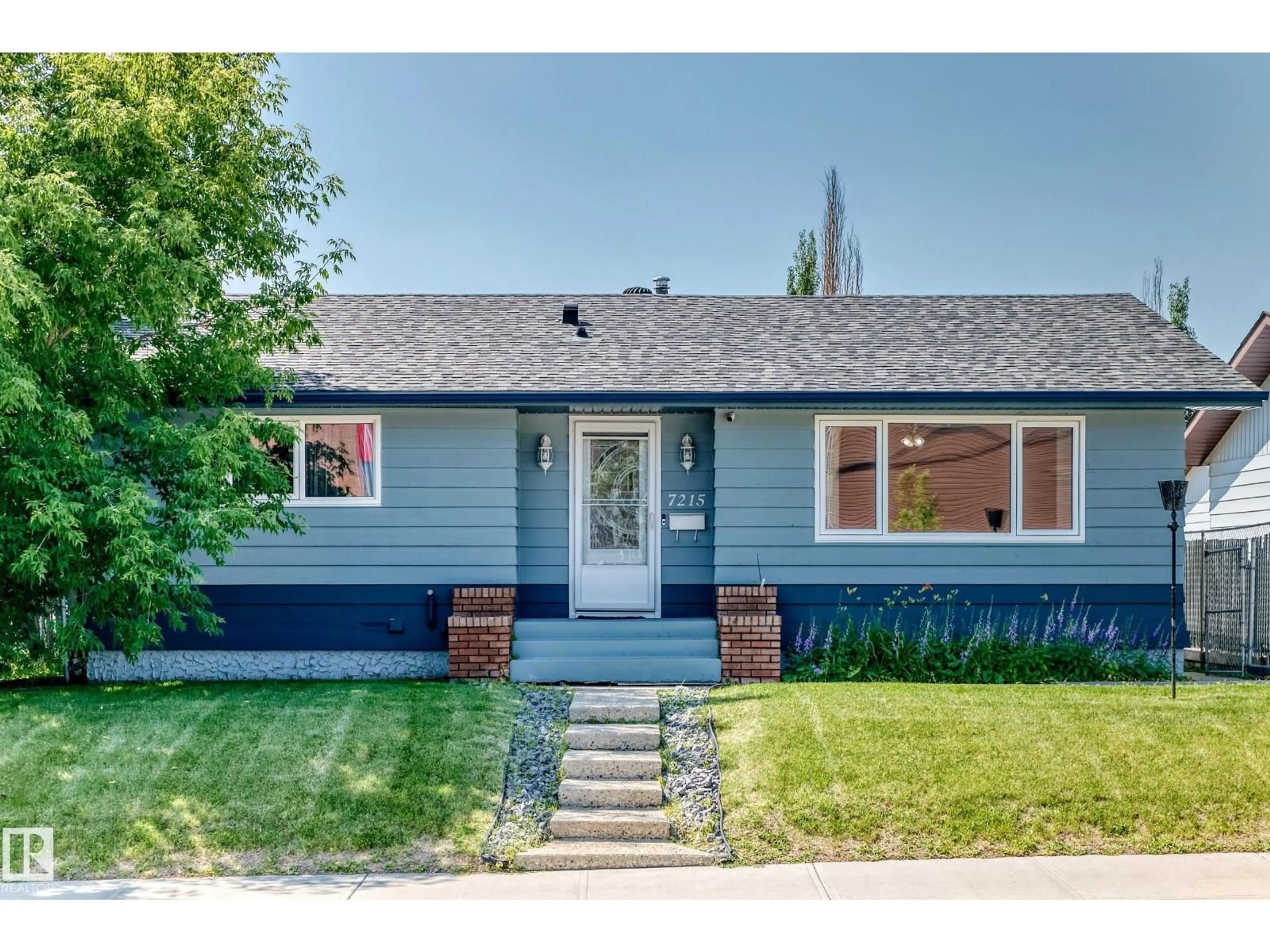 Home with vinyl exterior material, street for 7215 144 AV, Edmonton Alberta T5C2R6