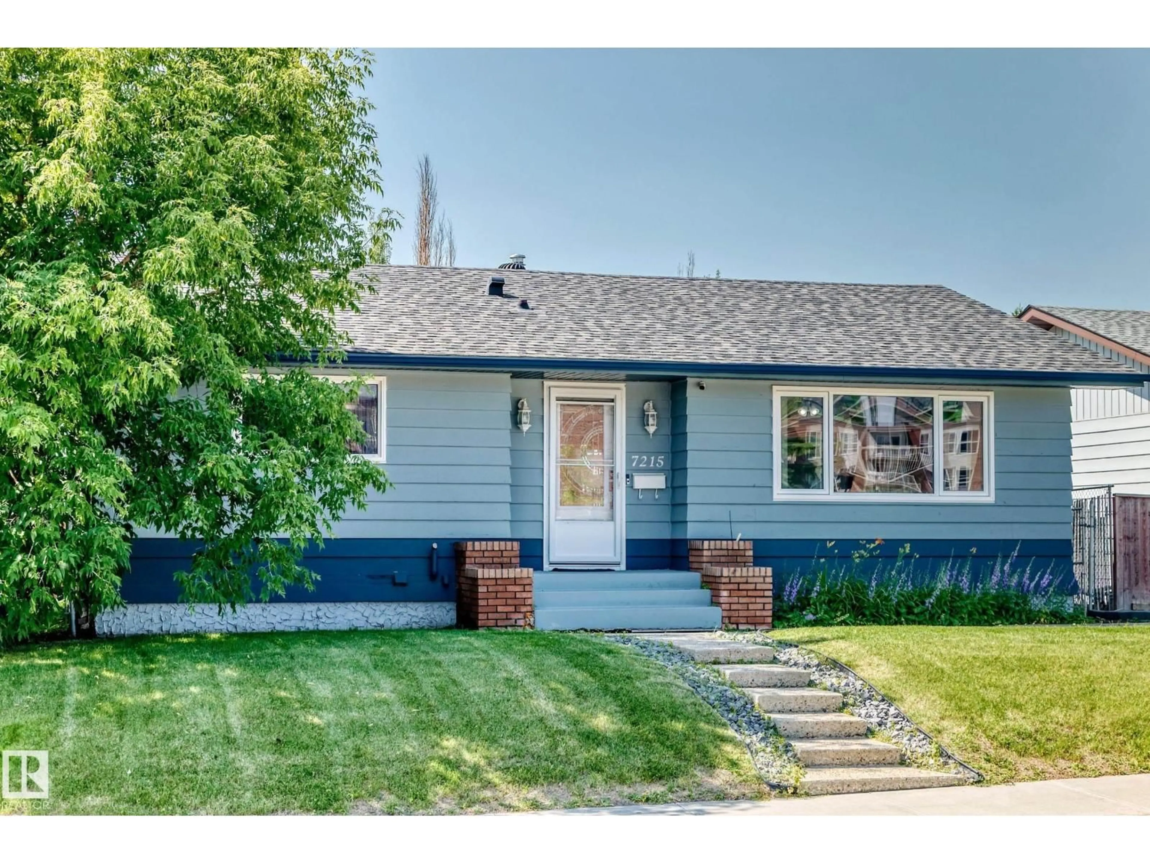 Home with vinyl exterior material, street for 7215 144 AV, Edmonton Alberta T5C2R6