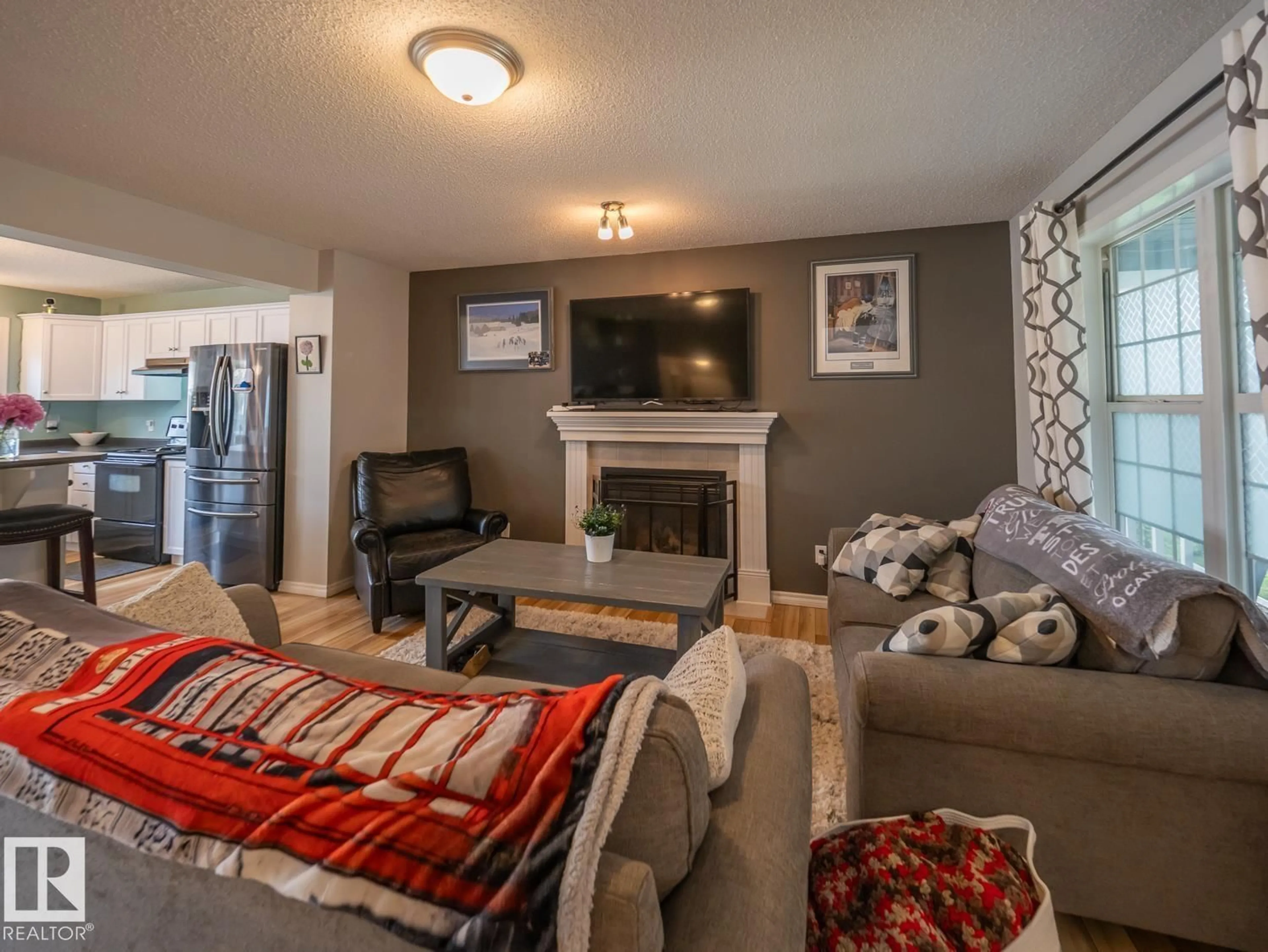 Living room with furniture, unknown for SW - 12124 17 AV, Edmonton Alberta T6W1M1