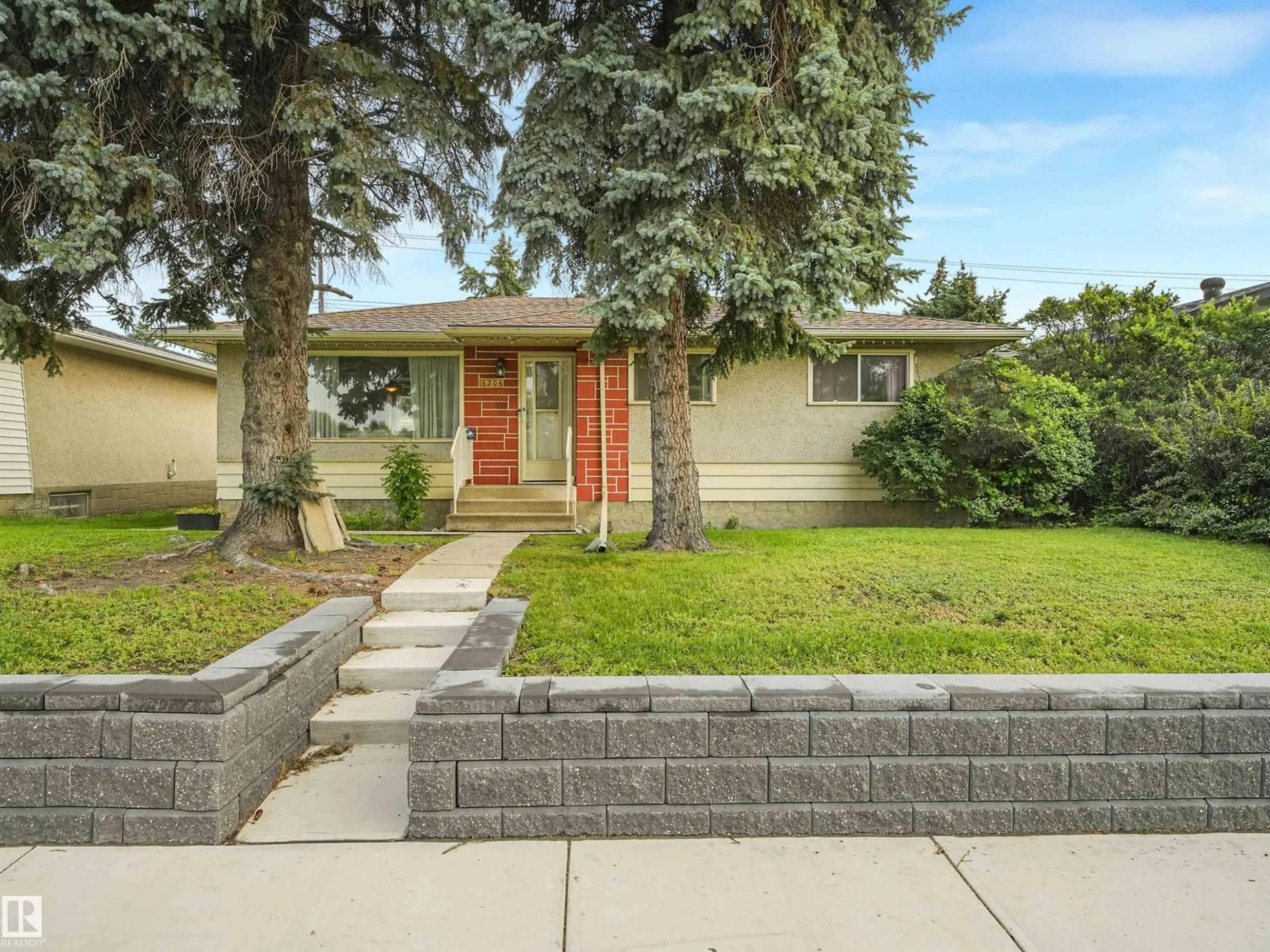 Home with brick exterior material, street for 6206 132 AV, Edmonton Alberta T5A0J7