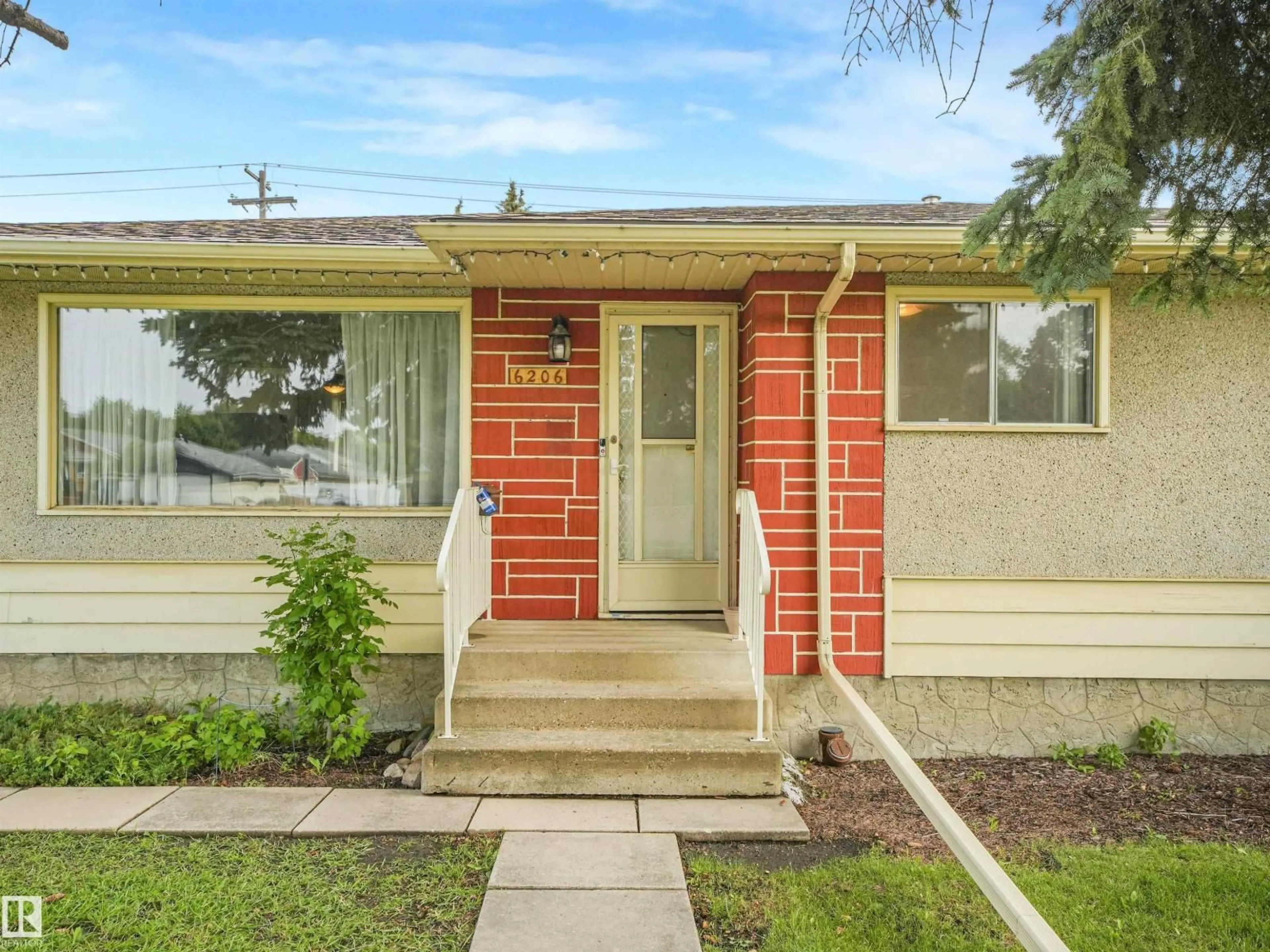 Home with brick exterior material, street for 6206 132 AV, Edmonton Alberta T5A0J7
