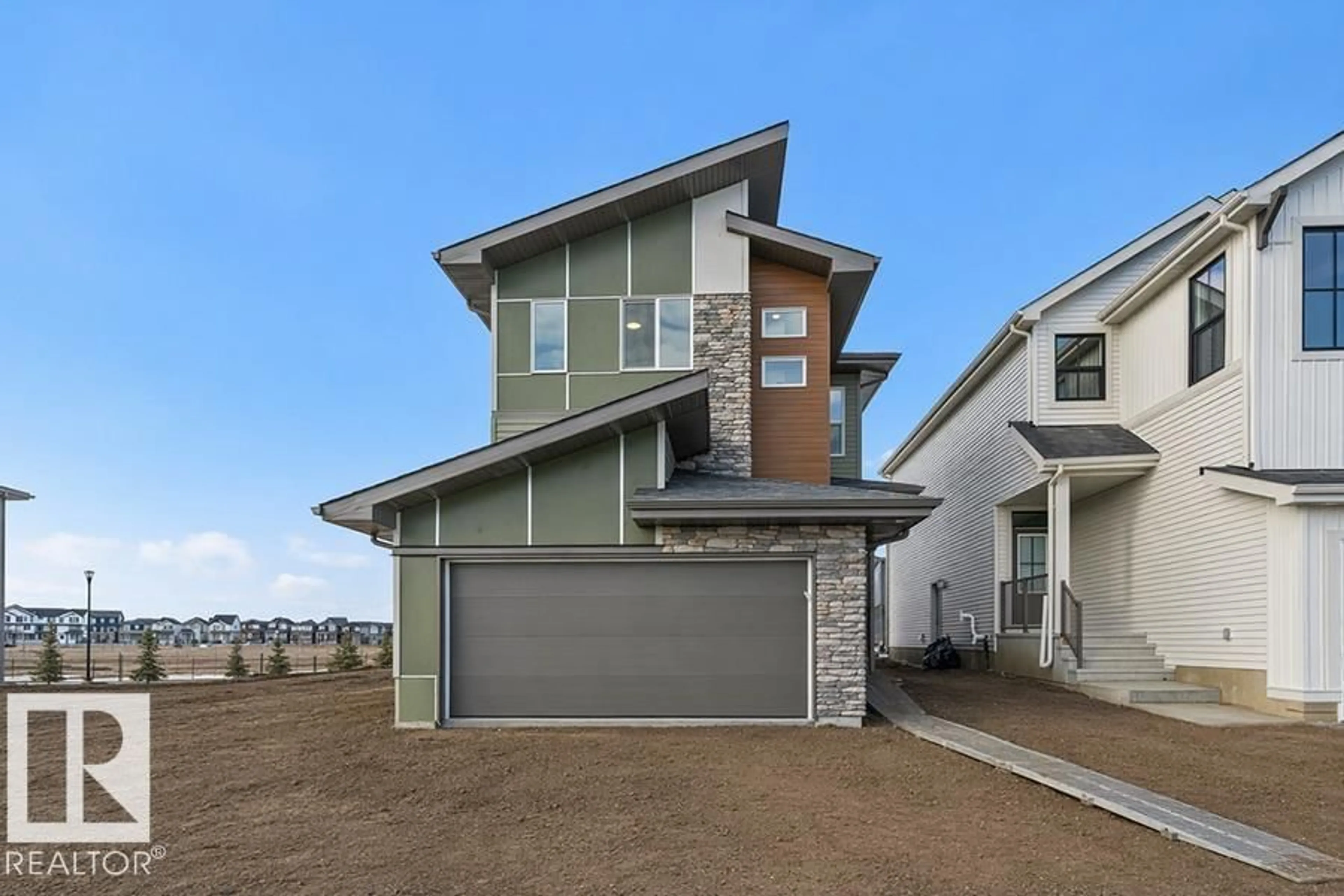 Home with vinyl exterior material, street for NW - 2804 190 ST, Edmonton Alberta T6M3H8