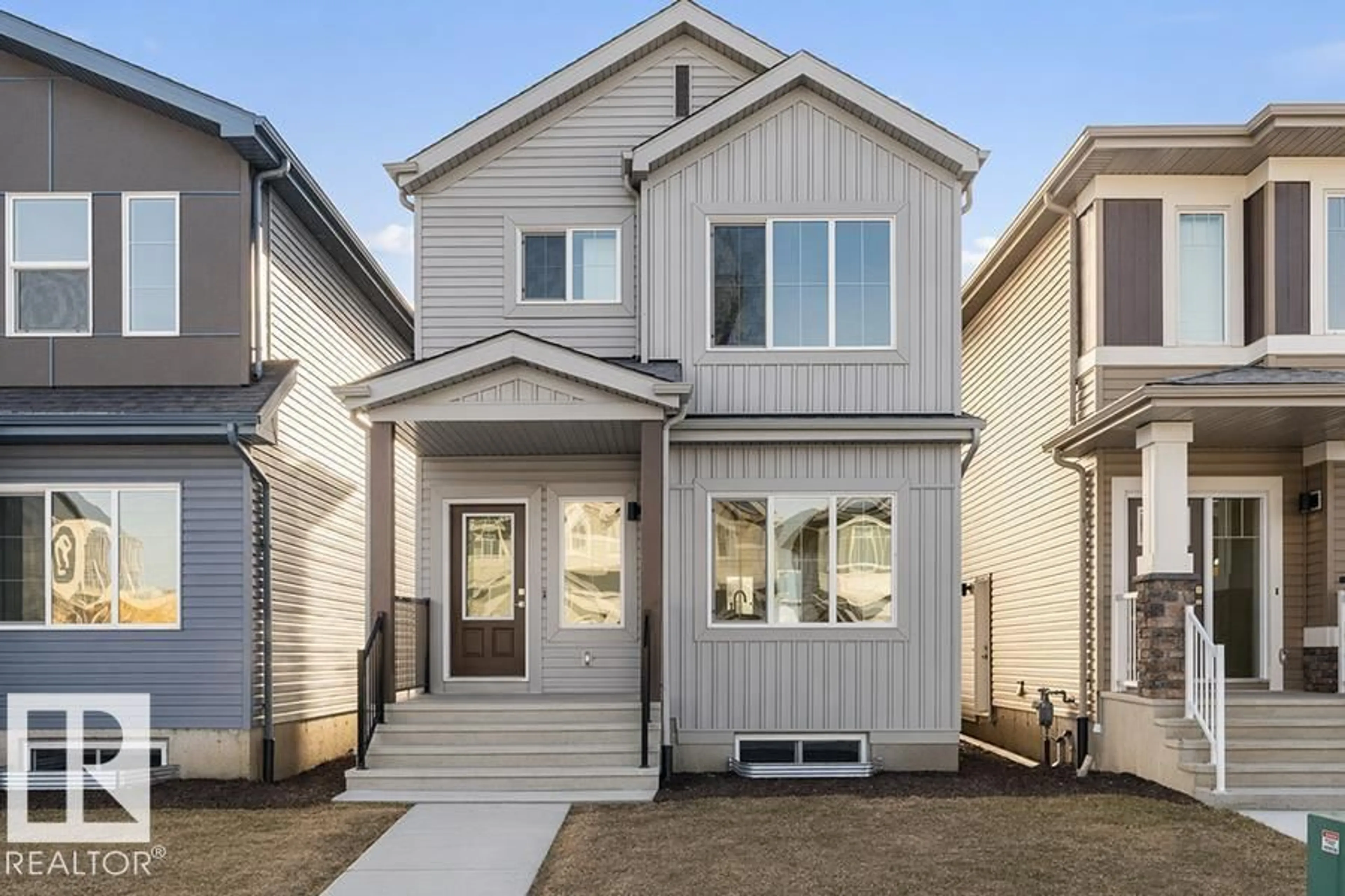 Home with vinyl exterior material, street for 18859 29 AV, Edmonton Alberta T6M3C5