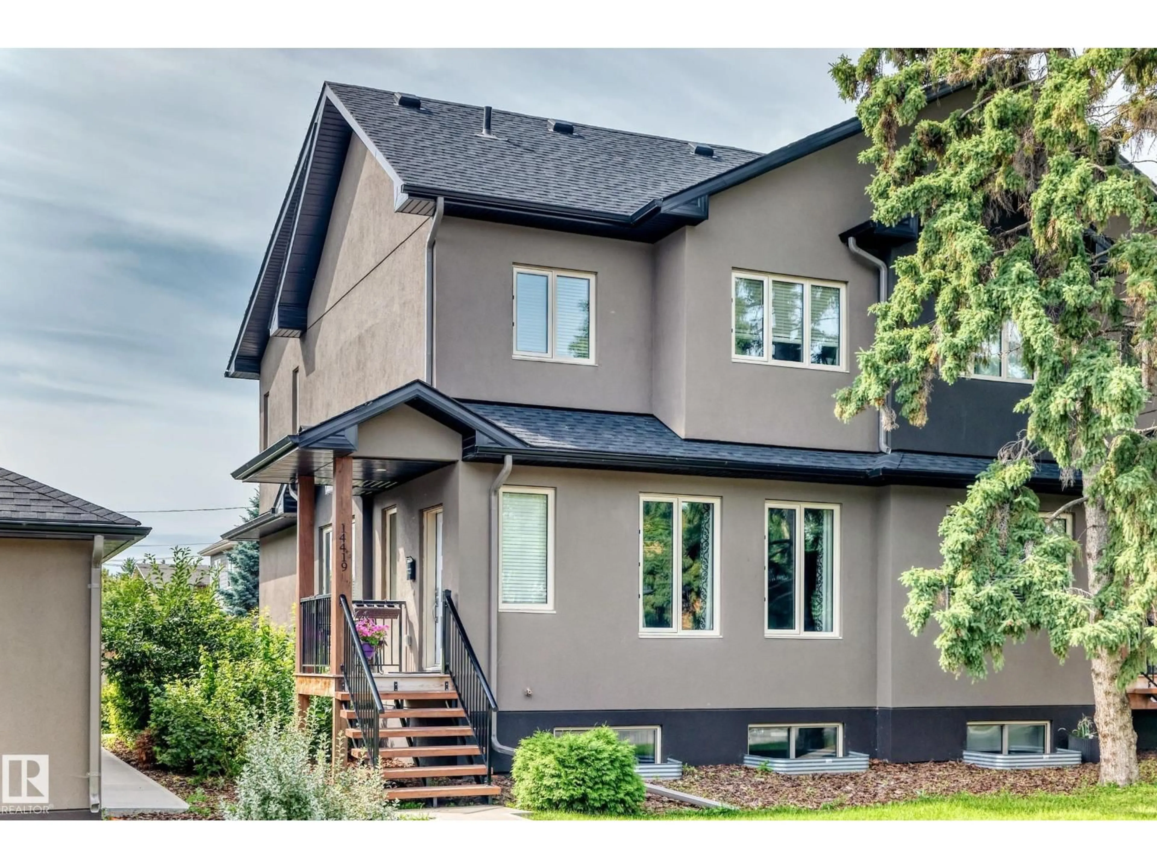Home with vinyl exterior material, street for NW - 14419 104 AV, Edmonton Alberta T5N2X8