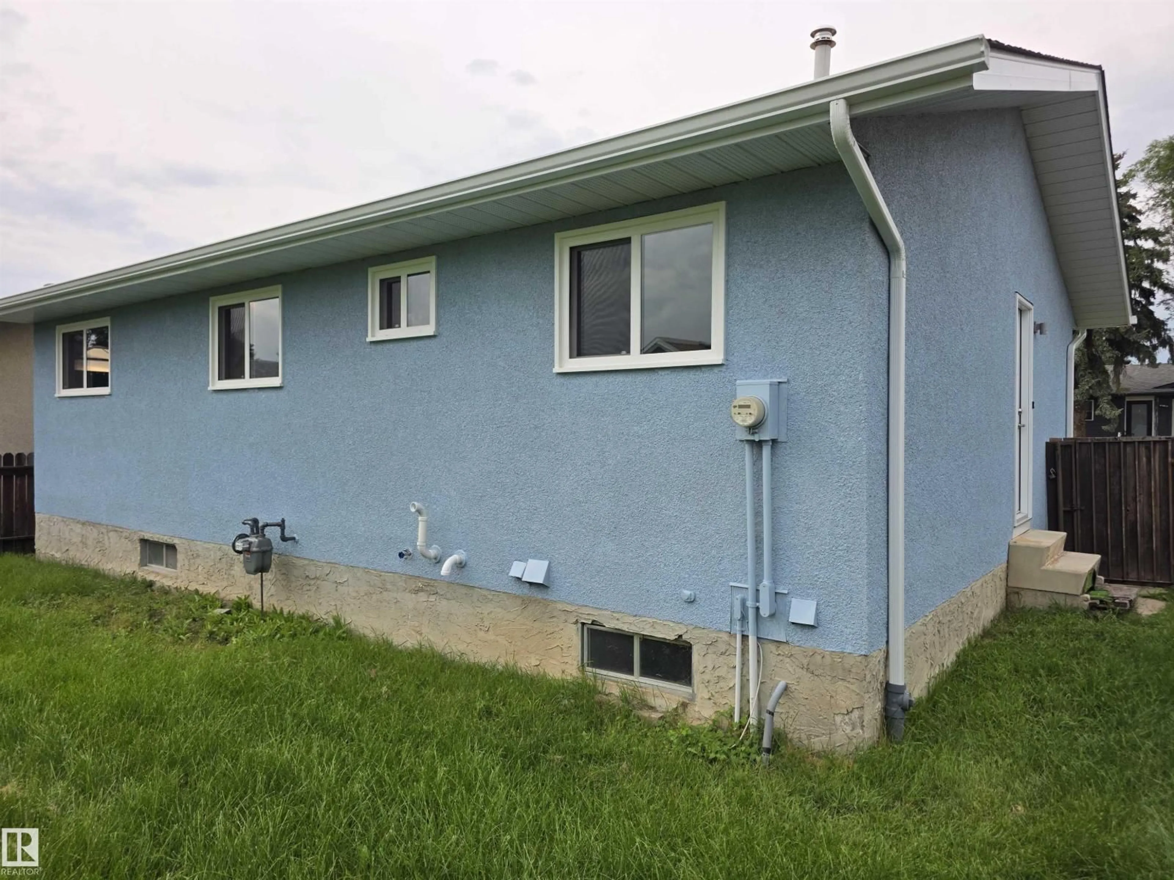 Home with vinyl exterior material, building for 1907 145A AV, Edmonton Alberta T5Y1S9