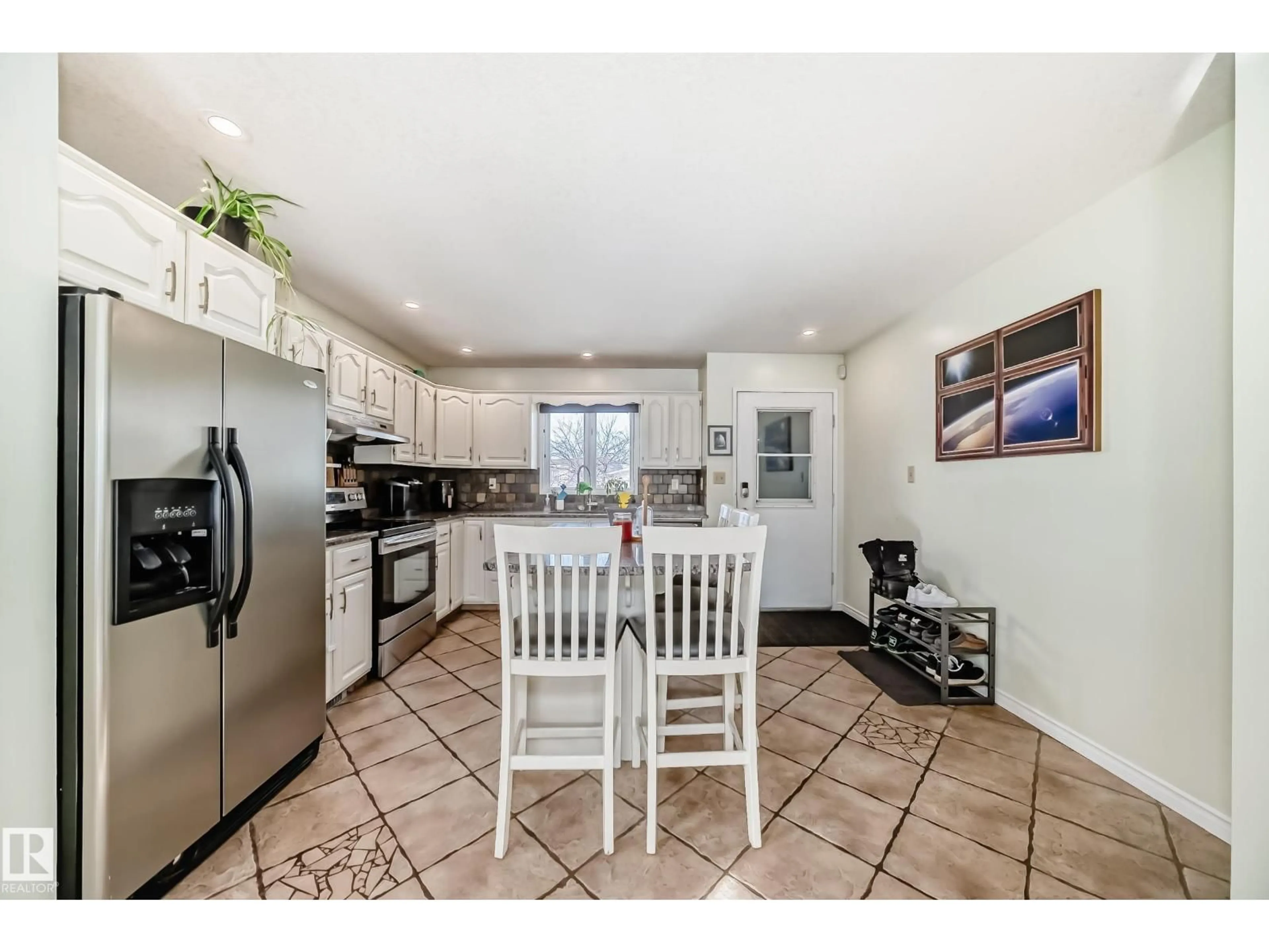Open concept kitchen, ceramic/tile floor for 16232 100 ST, Edmonton Alberta T5X4R7