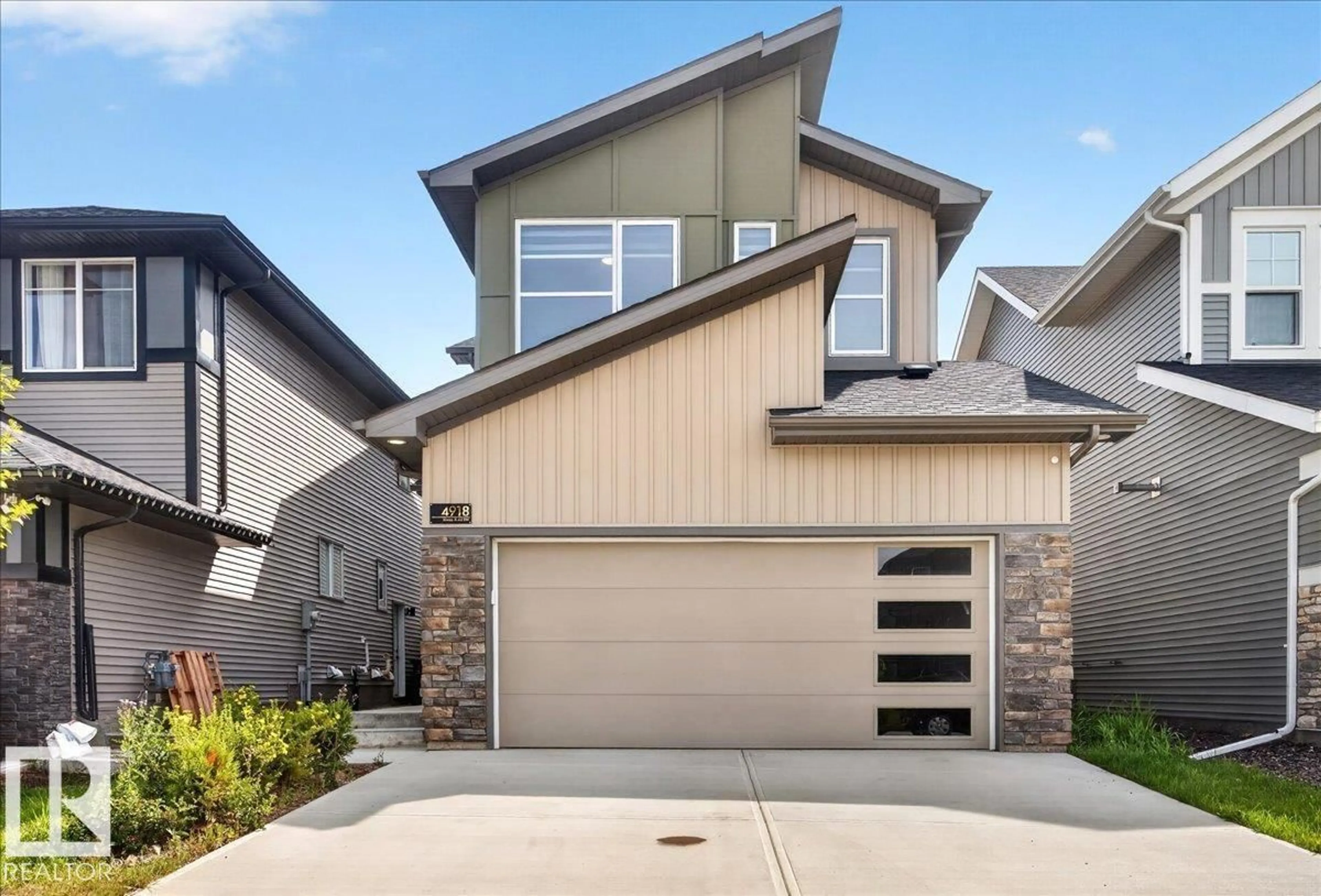 Home with vinyl exterior material, street for 4918 KINNEY RD, Edmonton Alberta T6W5H1