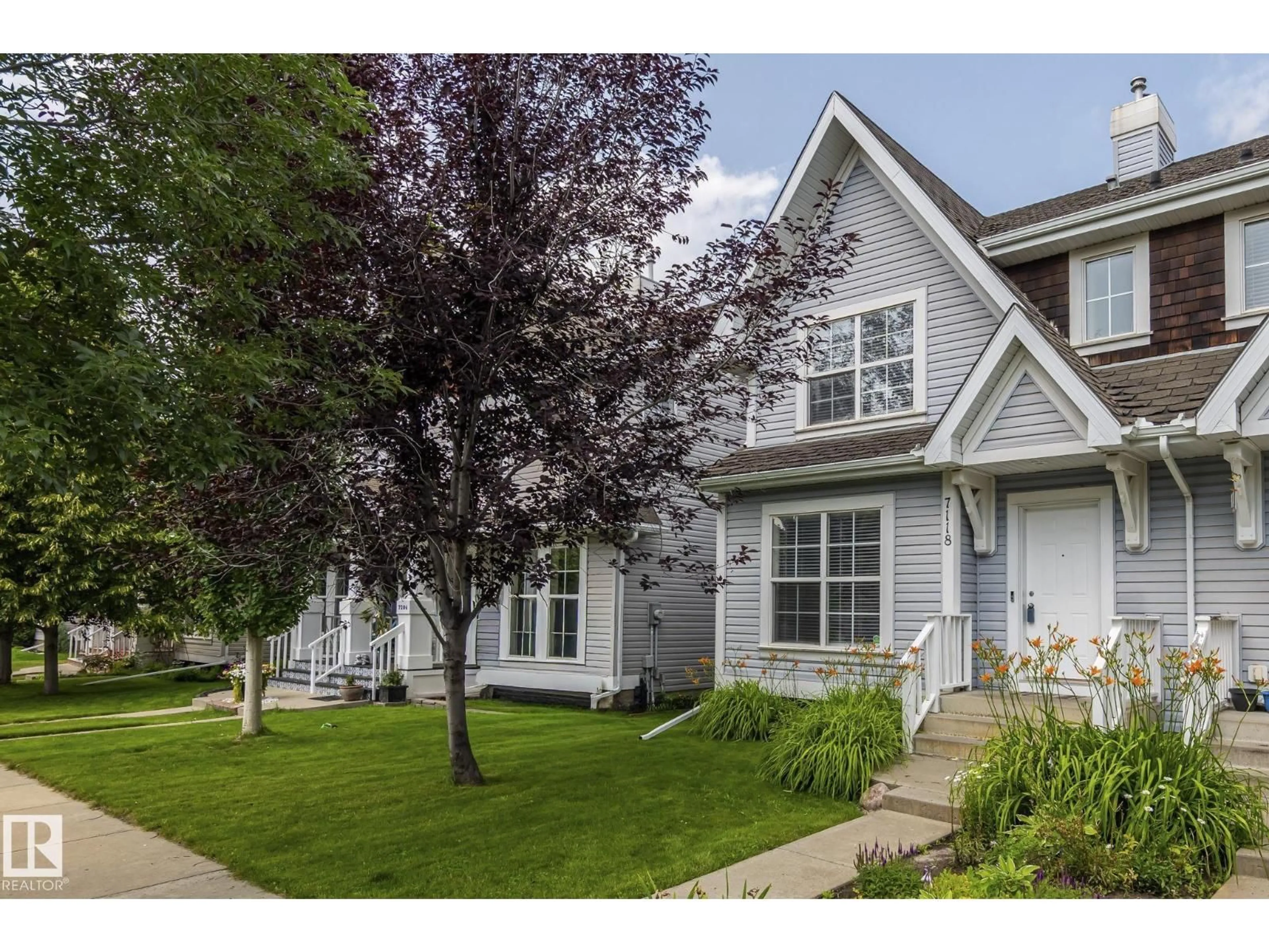Home with vinyl exterior material, street for 7118 19A AV, Edmonton Alberta T6X0K2