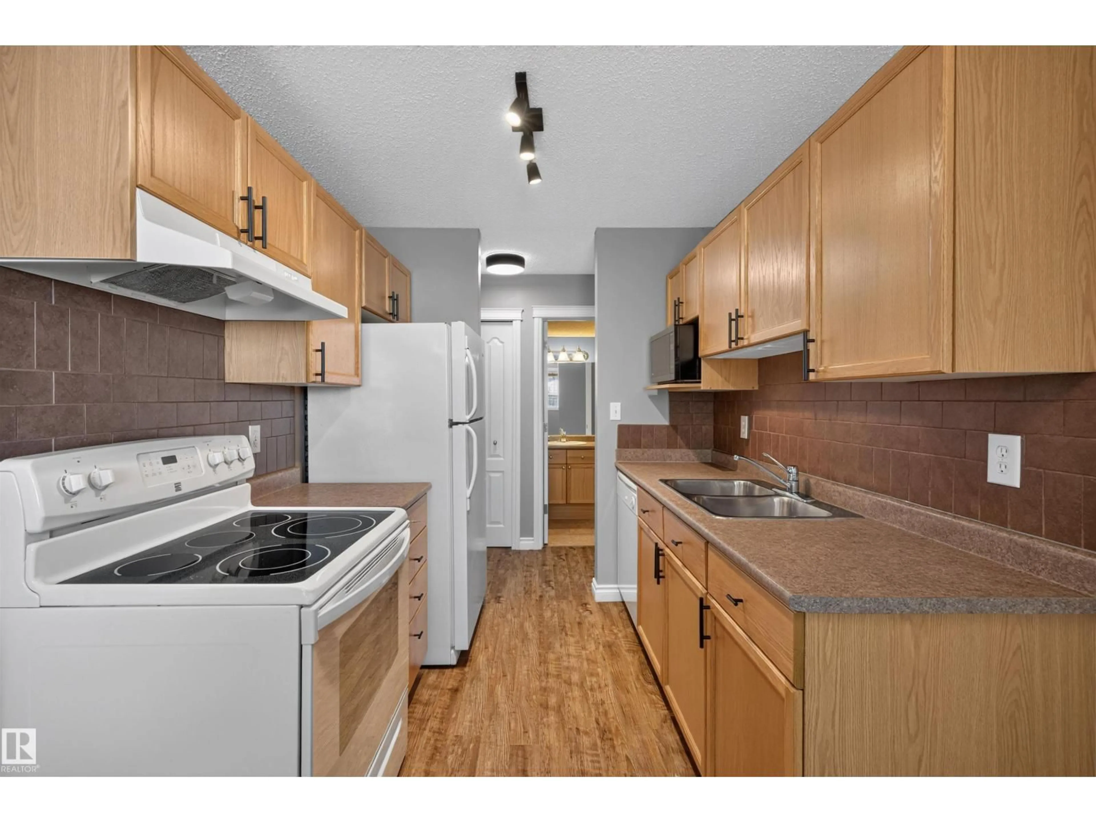 Standard kitchen, wood/laminate floor for #4 - 4616 47 ST, Leduc Alberta T9E4P1
