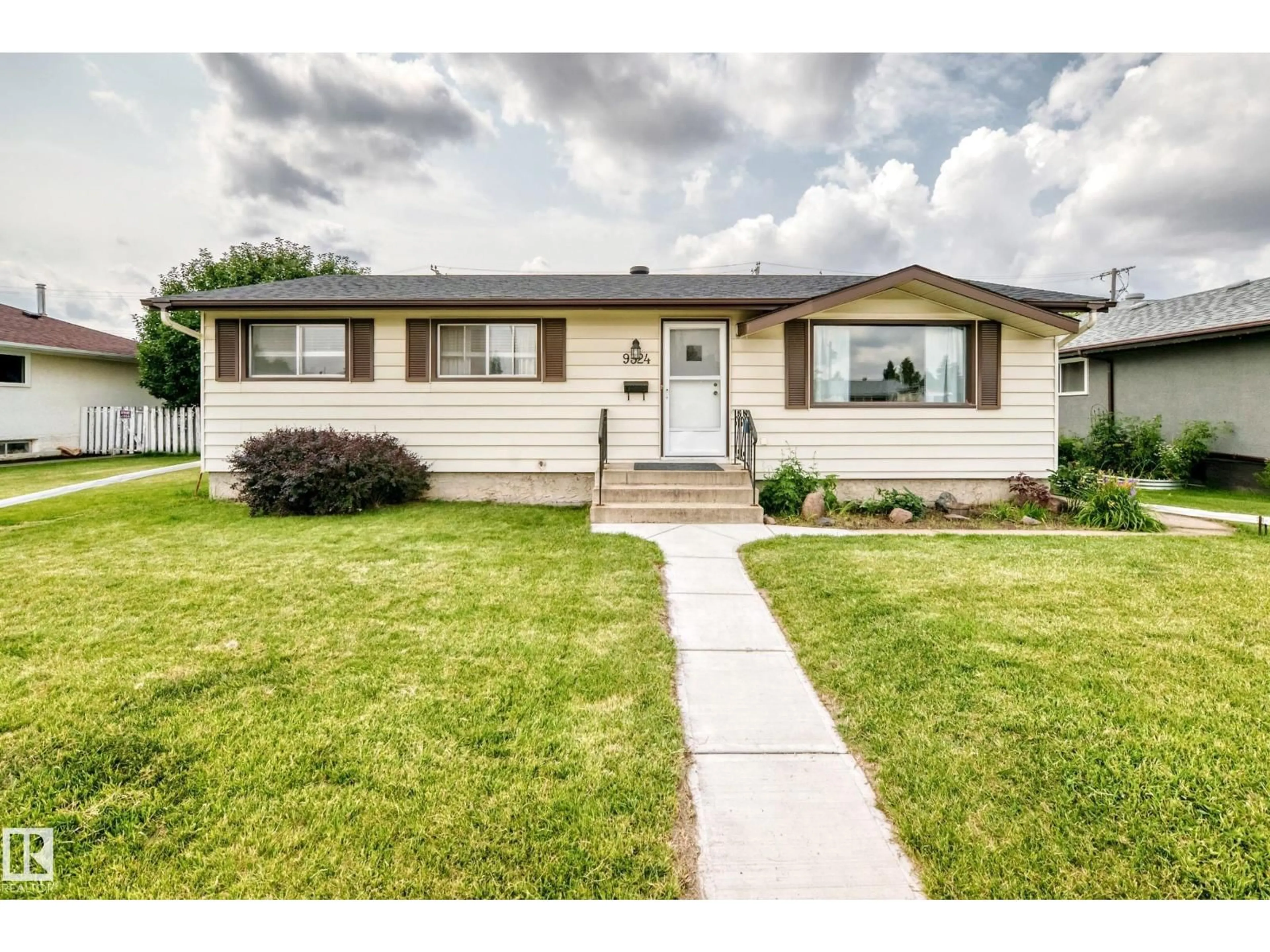 Home with vinyl exterior material, street for 9324 OTTEWELL RD, Edmonton Alberta T6B2C9