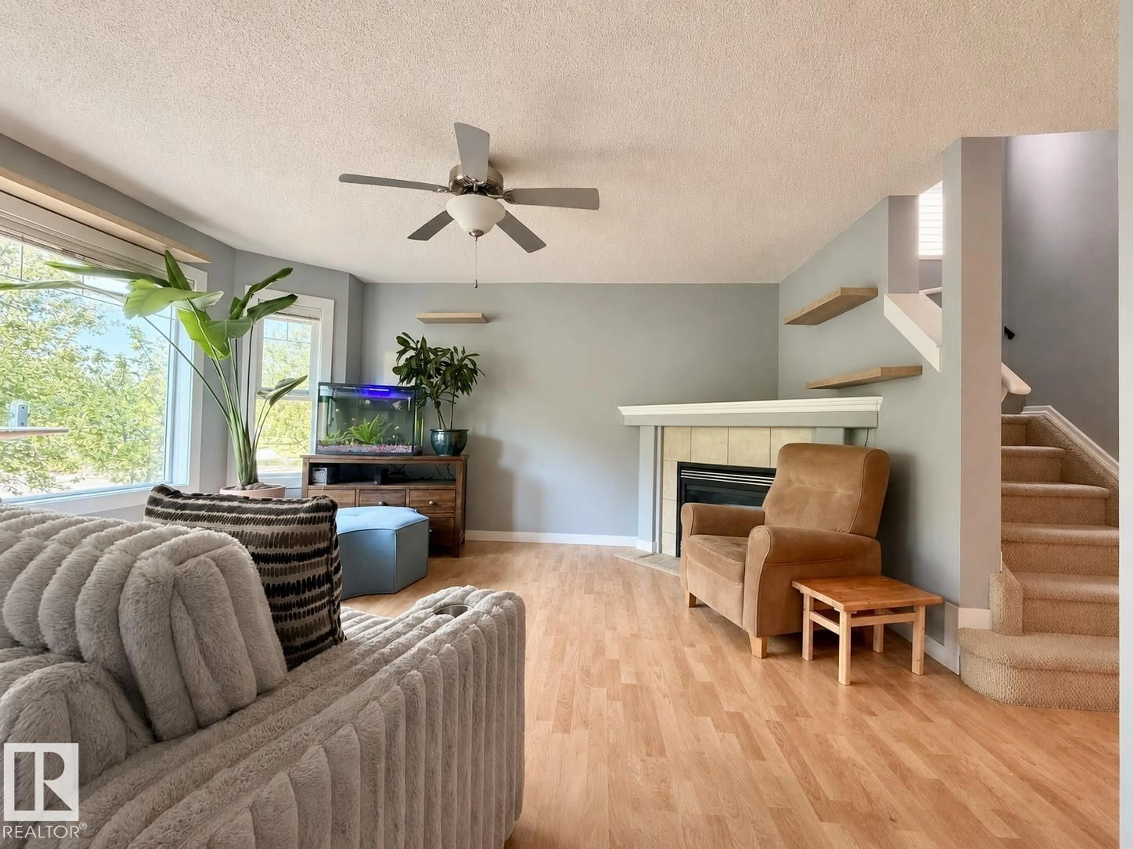 Living room with furniture, wood/laminate floor for 105 KEYSTONE CR, Leduc Alberta T9E0J4