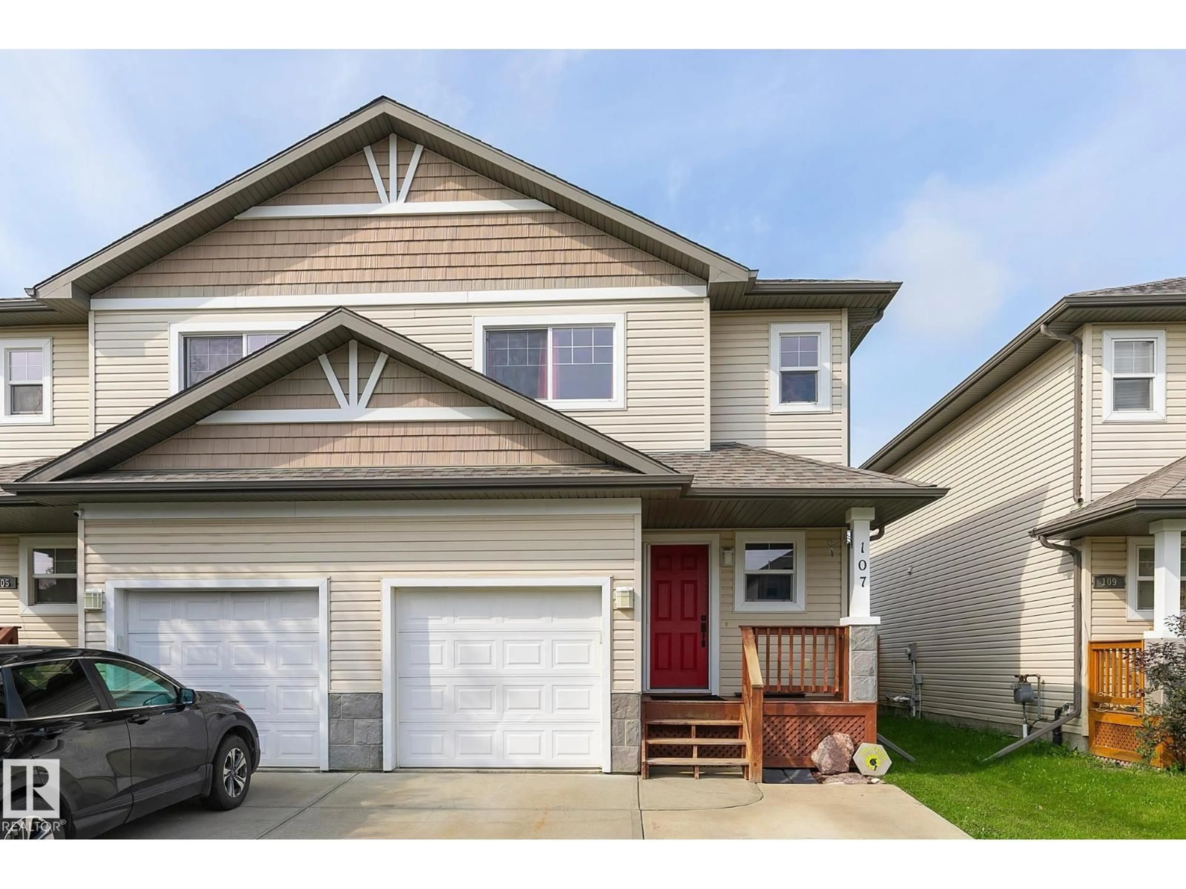 Home with vinyl exterior material, street for 107 HARTWICK LO, Spruce Grove Alberta T7X0A5