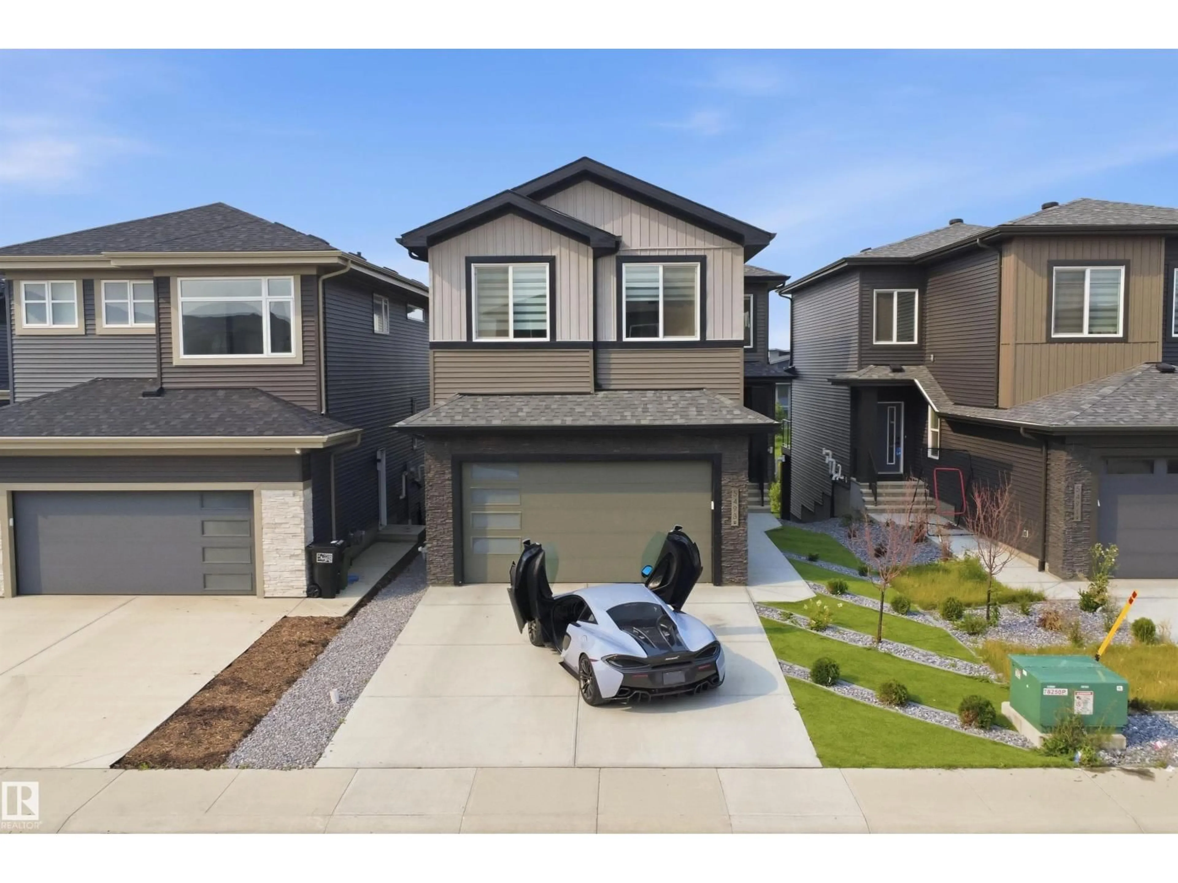 Home with vinyl exterior material, street for 5493 KOOTOOK RD, Edmonton Alberta T6W4Z5