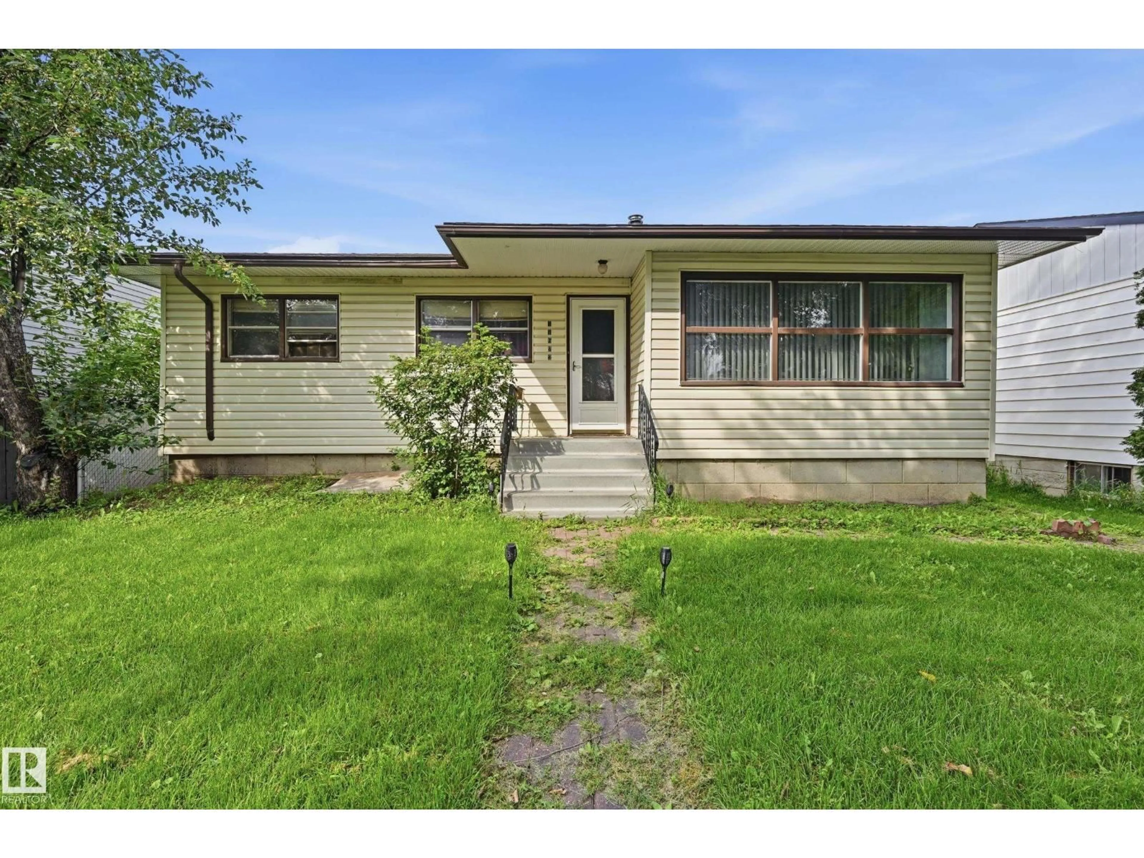 Home with vinyl exterior material, street for NW - 11622 133 ST, Edmonton Alberta T5M1H5