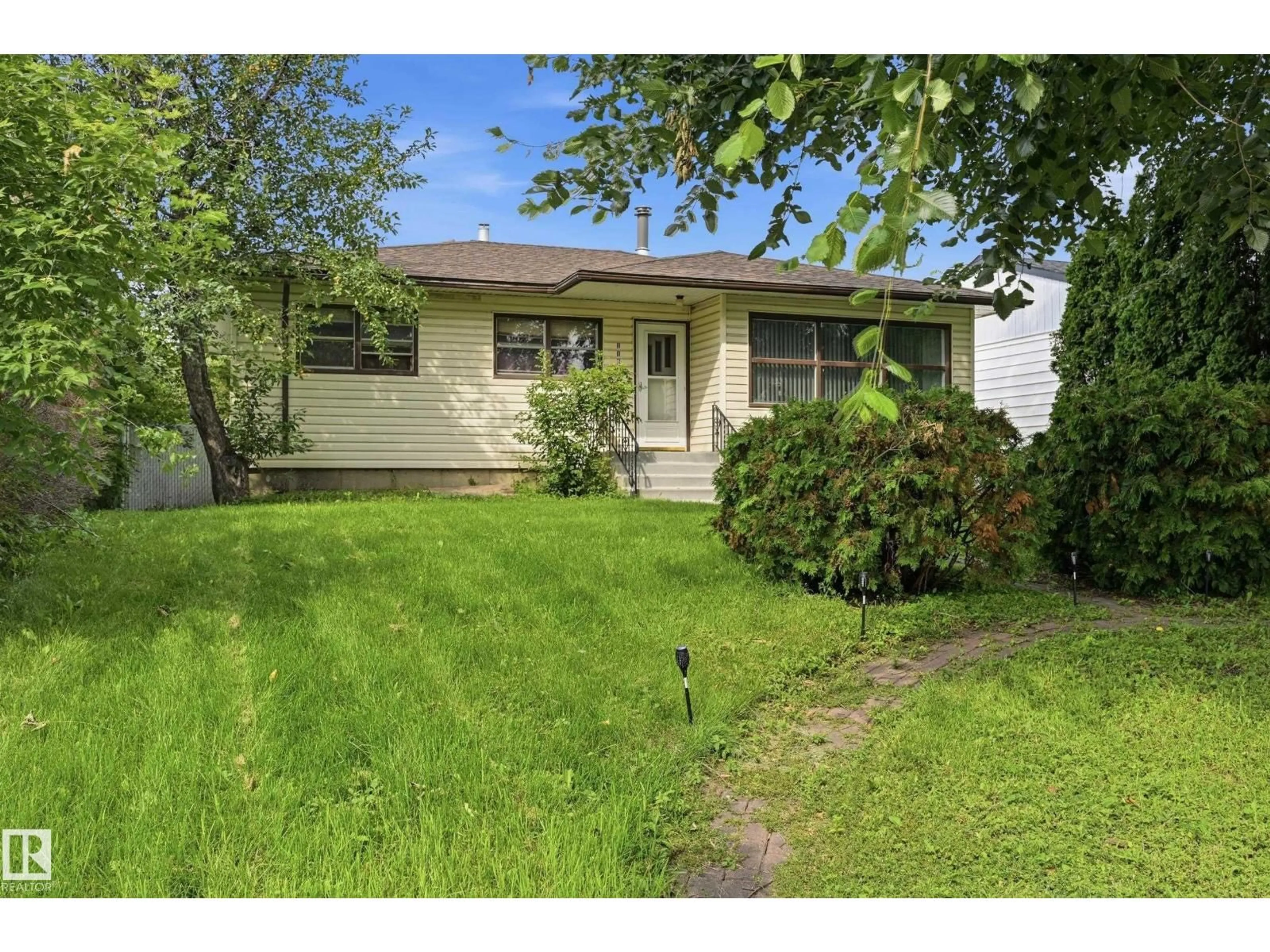 Home with vinyl exterior material, street for NW - 11622 133 ST, Edmonton Alberta T5M1H5