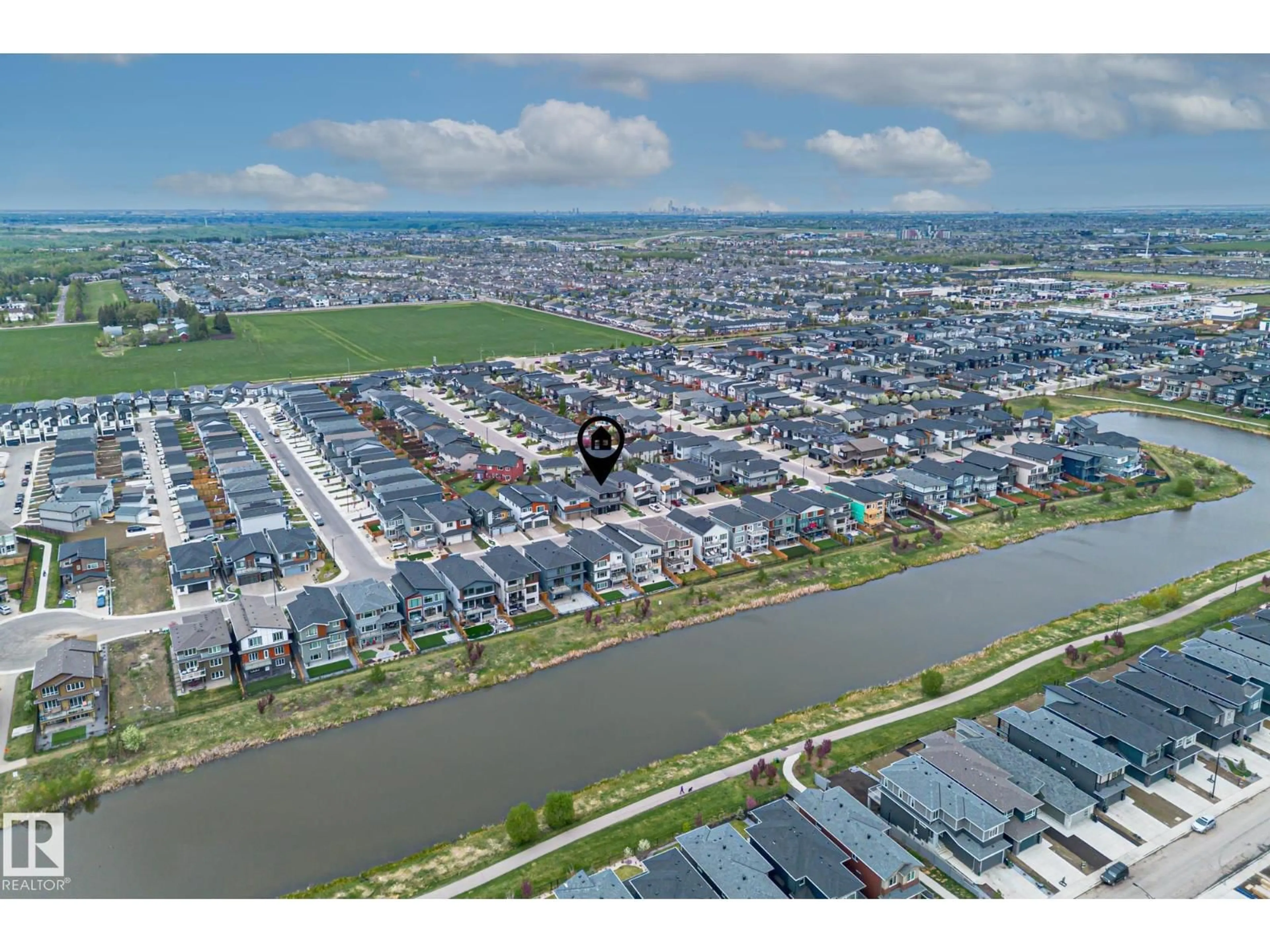 A pic from outside/outdoor area/front of a property/back of a property/a pic from drone, water/lake/river/ocean view for SW - 3116 KOSTASH GREEN GR, Edmonton Alberta T6W4K3