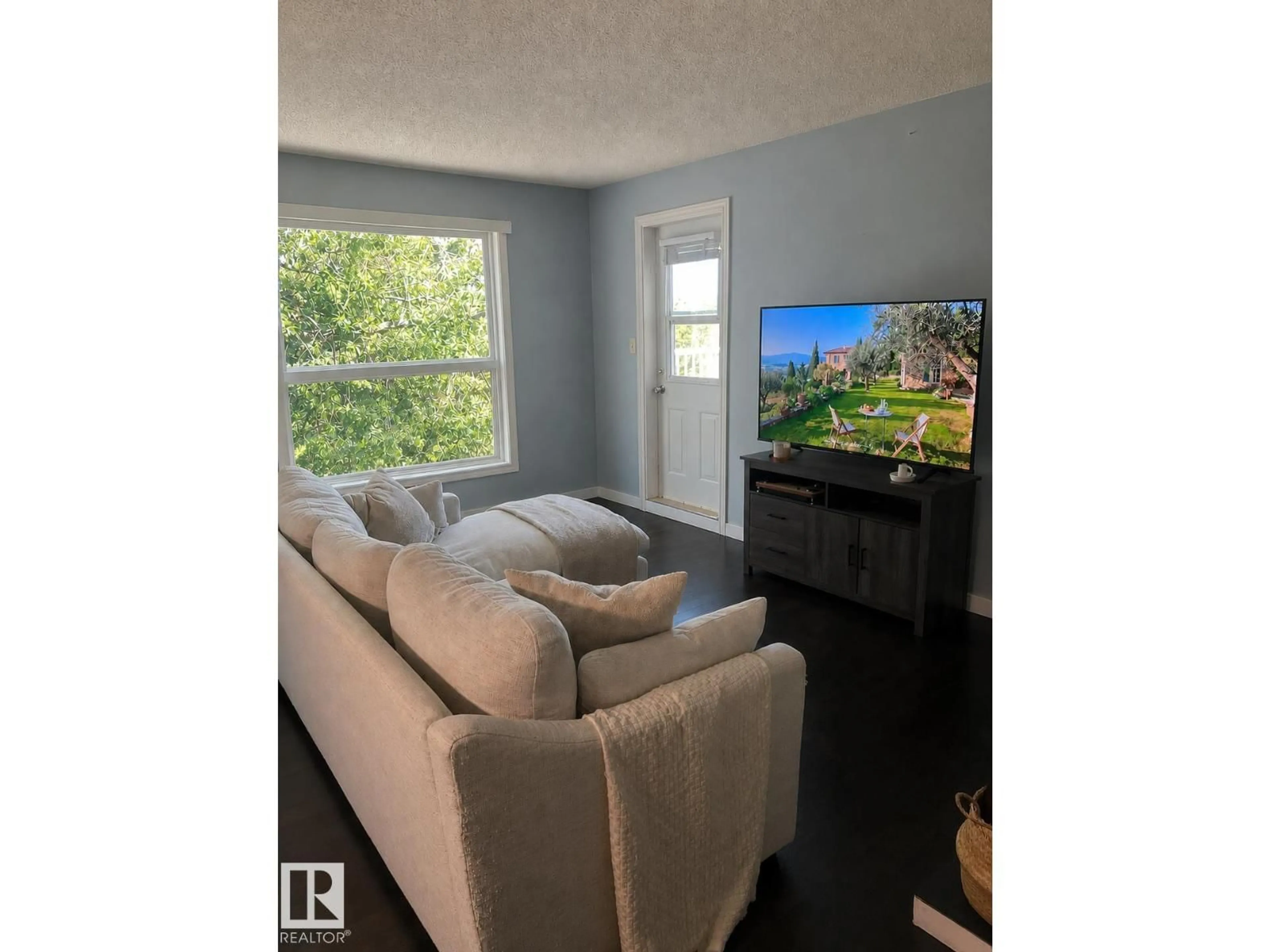 Living room with furniture, wood/laminate floor for 60 - 310 ALPINE PL, St. Albert Alberta T8N3Y2