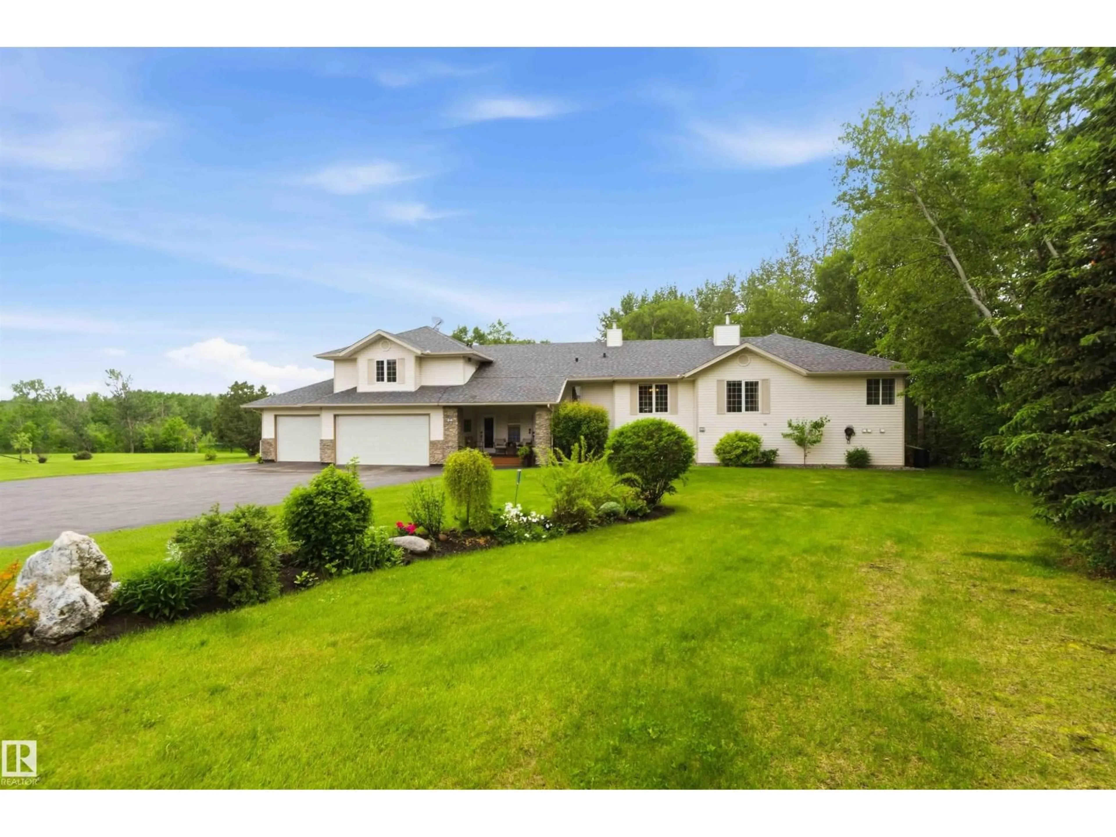A pic from outside/outdoor area/front of a property/back of a property/a pic from drone, water/lake/river/ocean view for 60 56019 RGE RD 230, Rural Sturgeon County Alberta T0A1N2