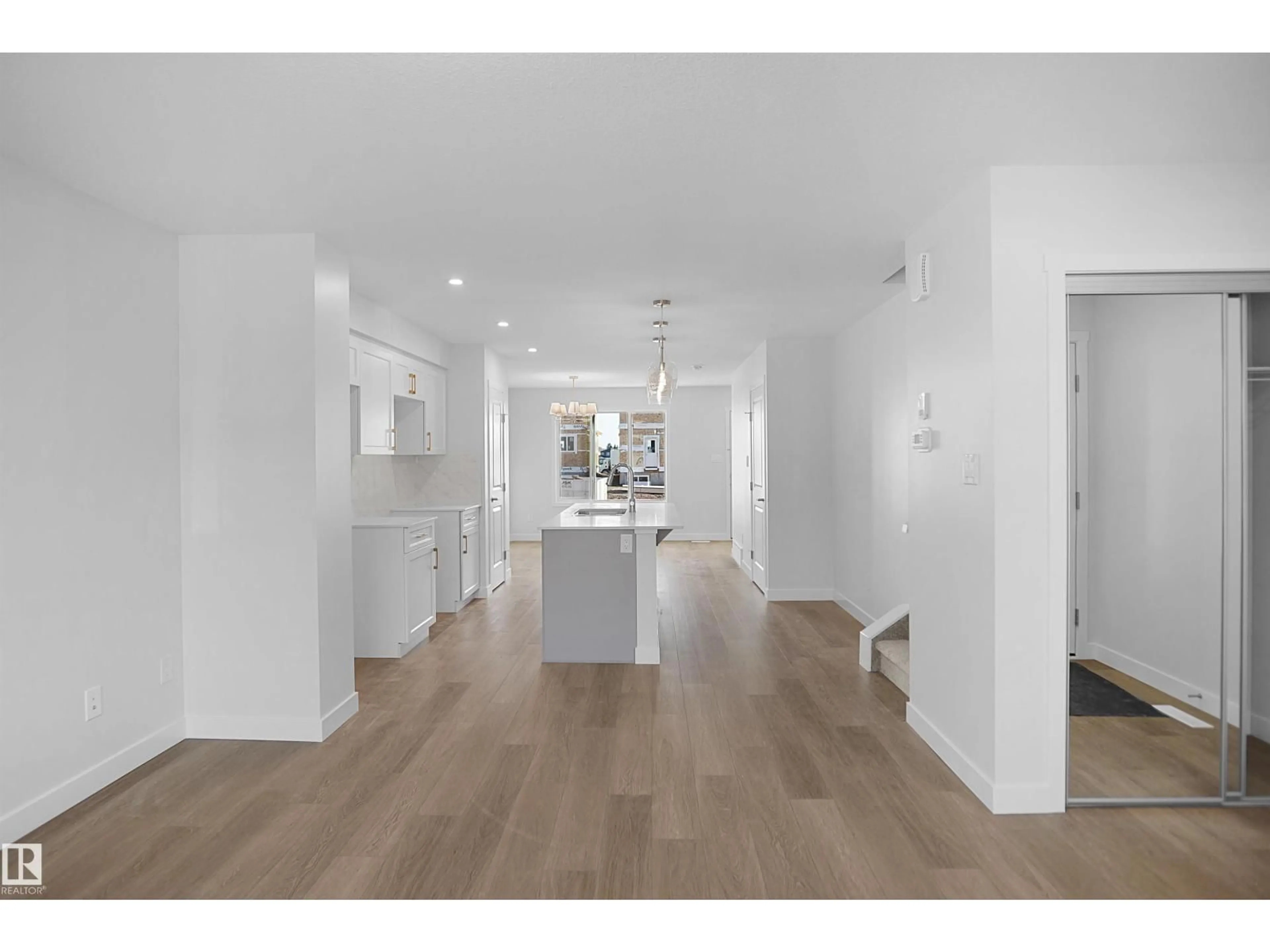 Open concept kitchen, wood/laminate floor for NW - 22521 83A AV, Edmonton Alberta T5T4N5