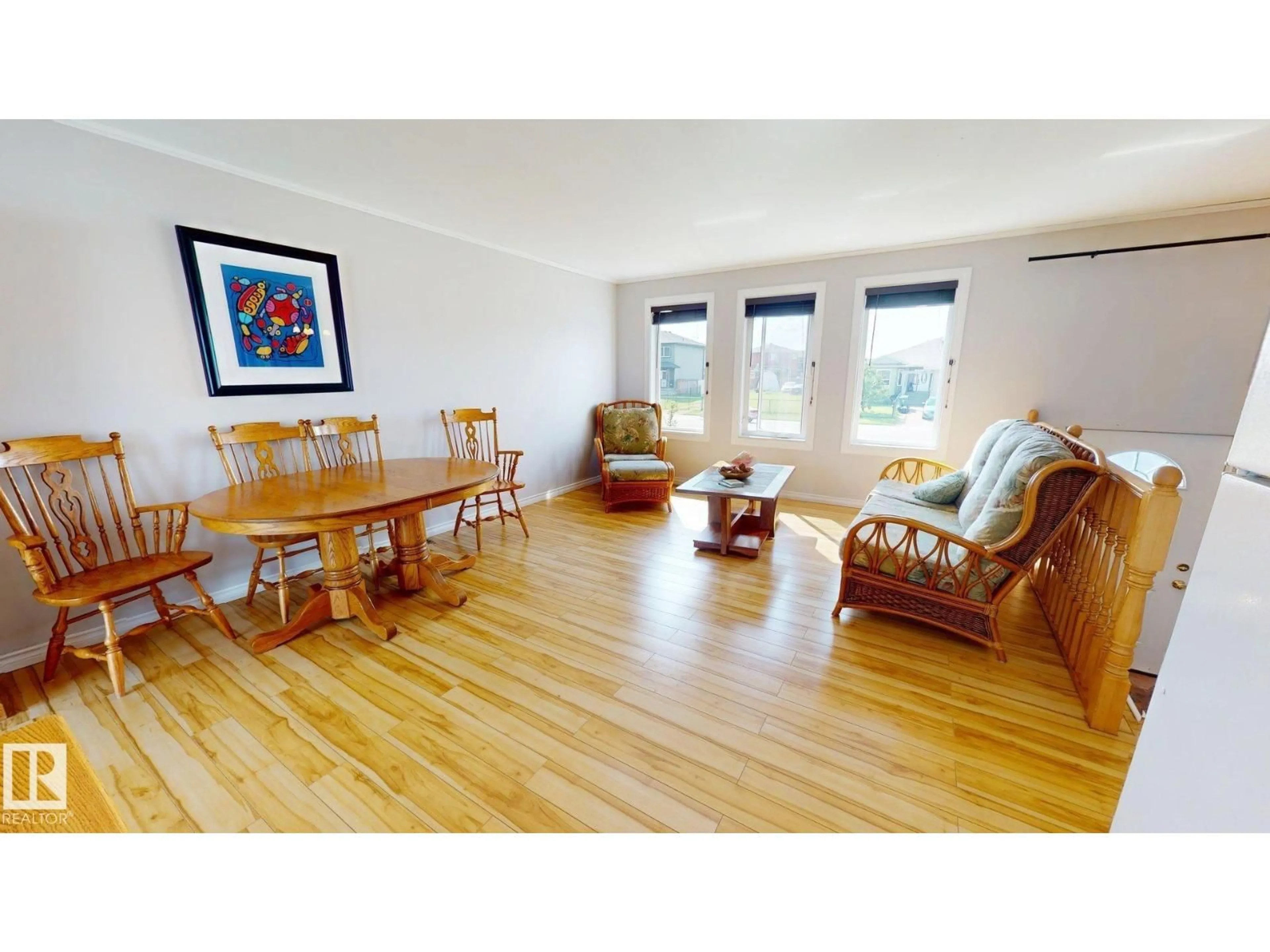 Living room with furniture, wood/laminate floor for 4825 55 ST, Bruderheim Alberta T0B0S0