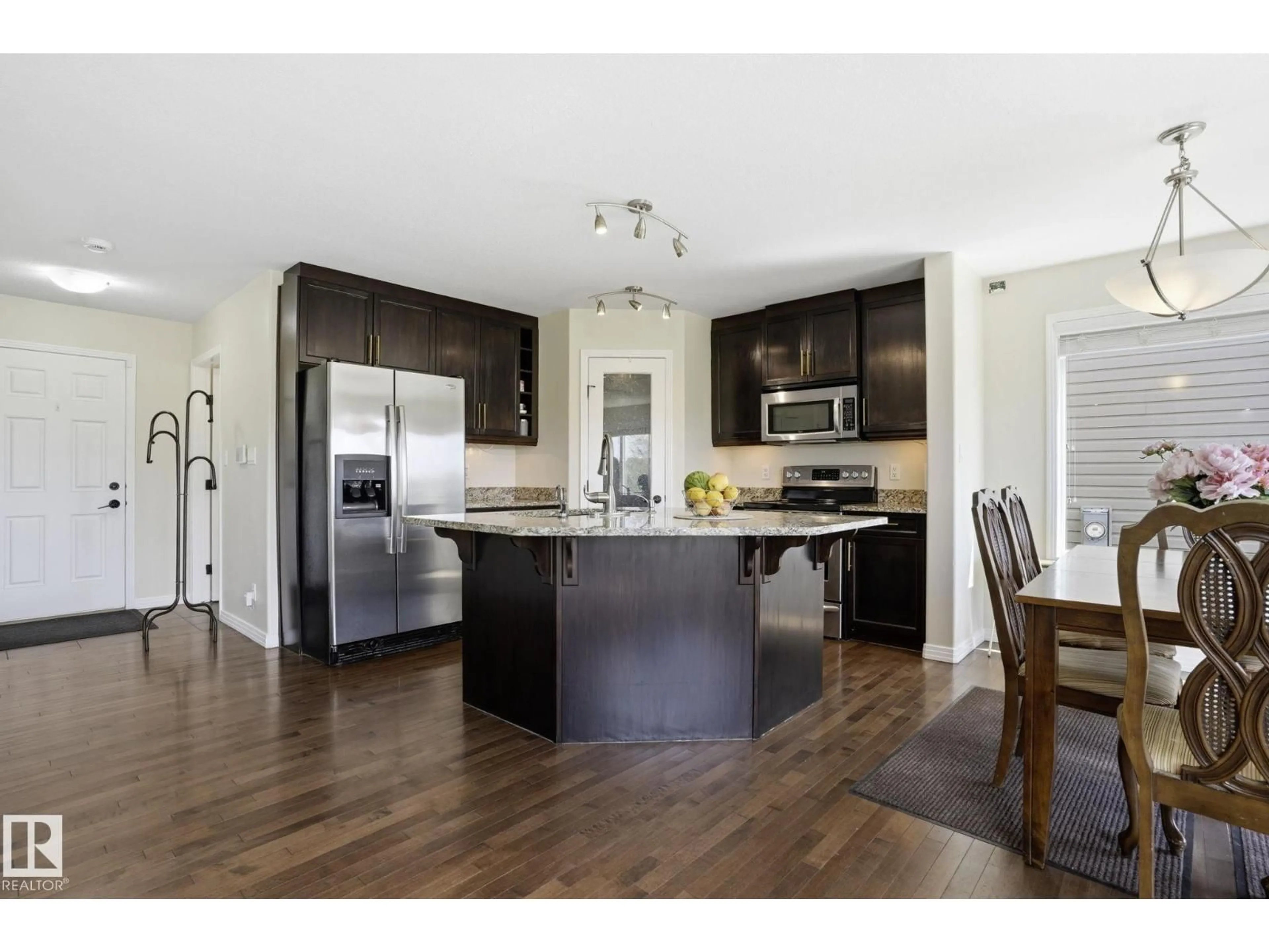 Open concept kitchen, wood/laminate floor for 10 ROCKWELL CL, Fort Saskatchewan Alberta T8L0E7