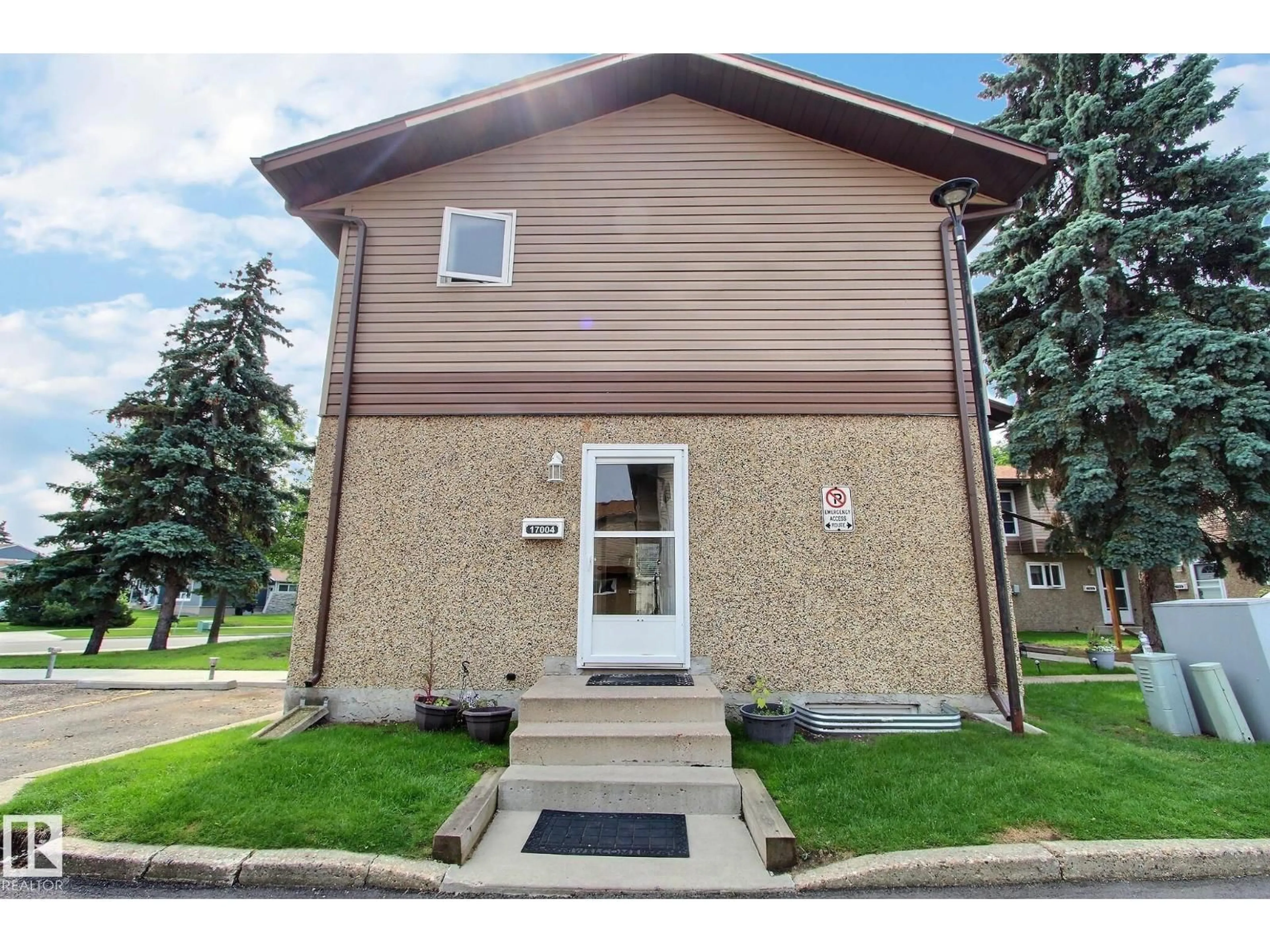 Home with vinyl exterior material, street for NW - 17004 100 ST, Edmonton Alberta T5X5E1