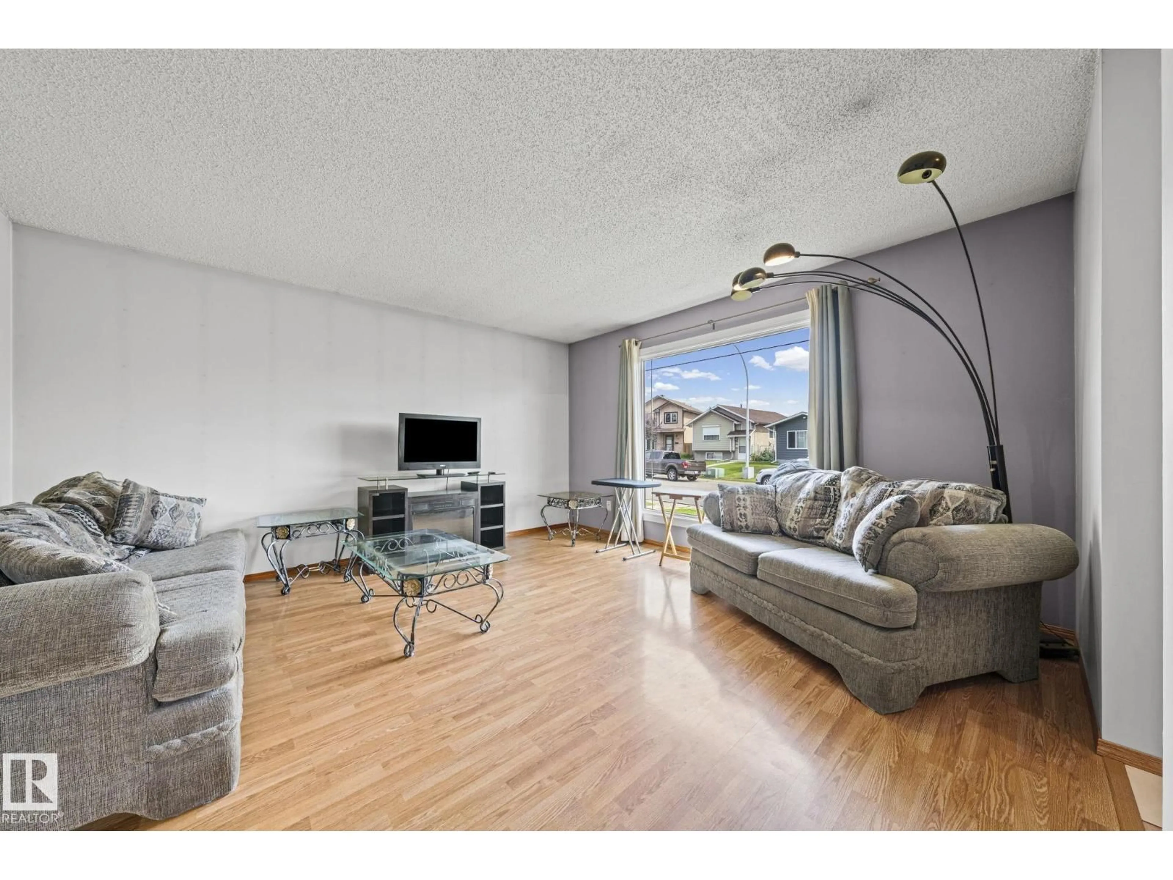 Living room with furniture, wood/laminate floor for NW - 17908 92A ST, Edmonton Alberta T5Z2J9