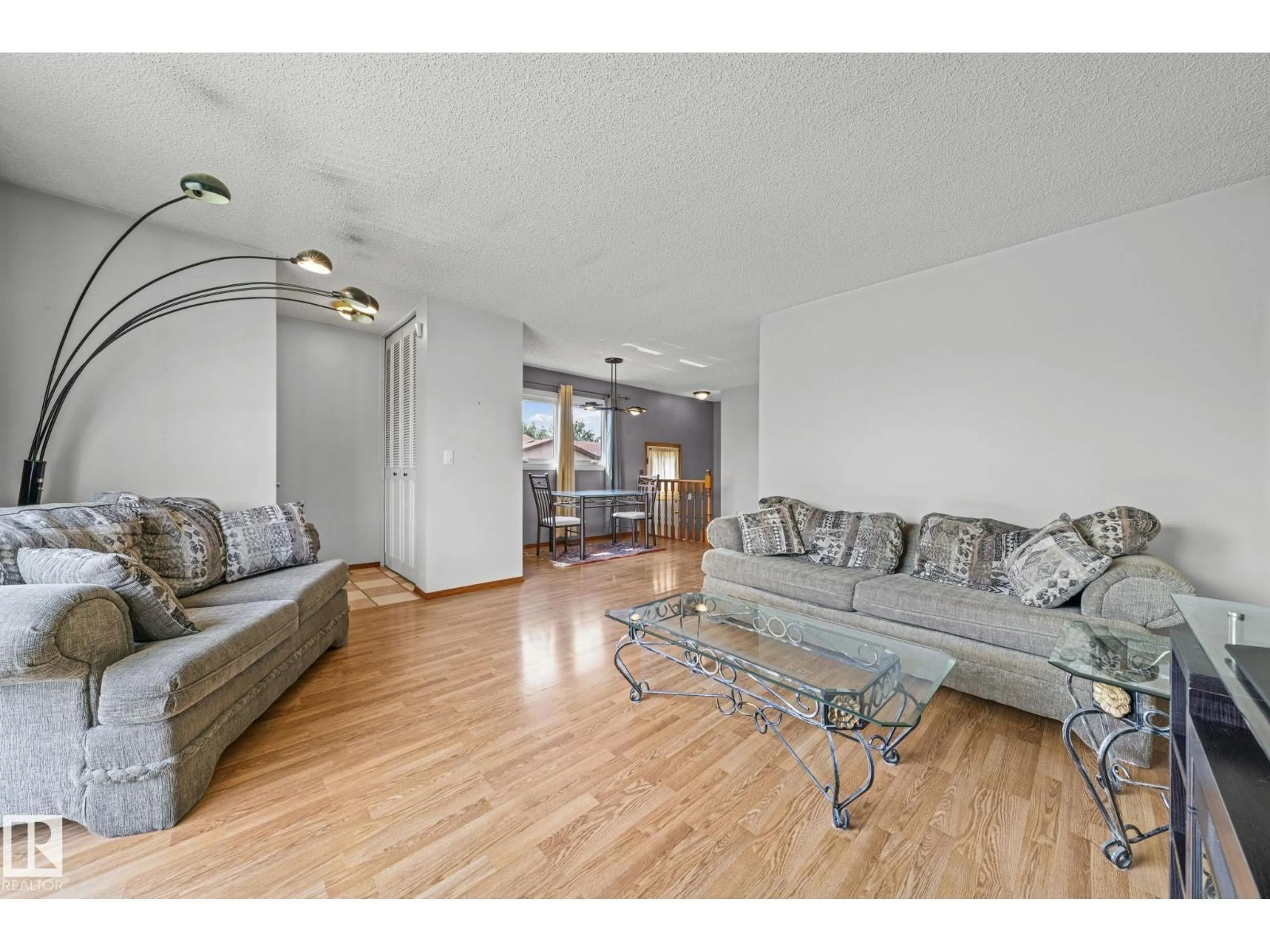 Living room with furniture, wood/laminate floor for NW - 17908 92A ST, Edmonton Alberta T5Z2J9