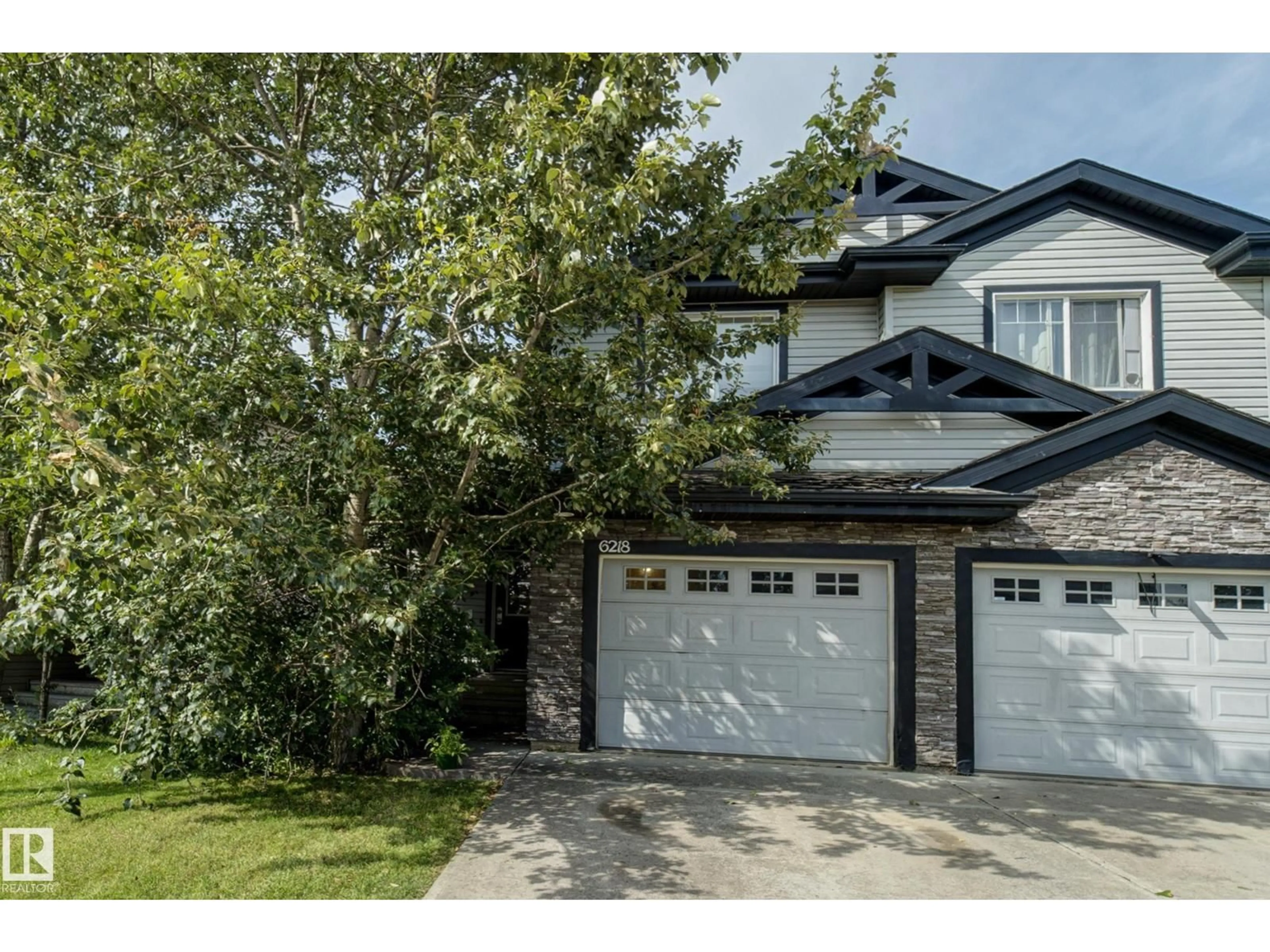 Home with brick exterior material, street for 6218 1A AV SW, Edmonton Alberta T6X0C1