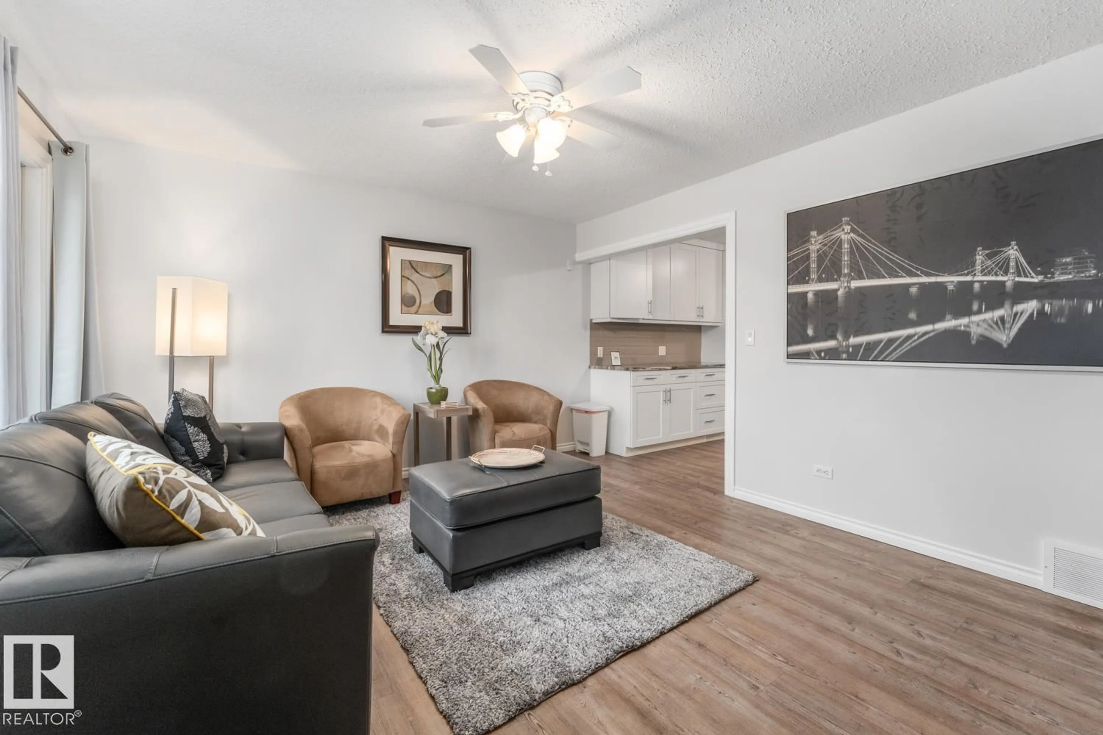 Living room with furniture, wood/laminate floor for 5210 51 AV, Bonnyville Town Alberta T9N2A8