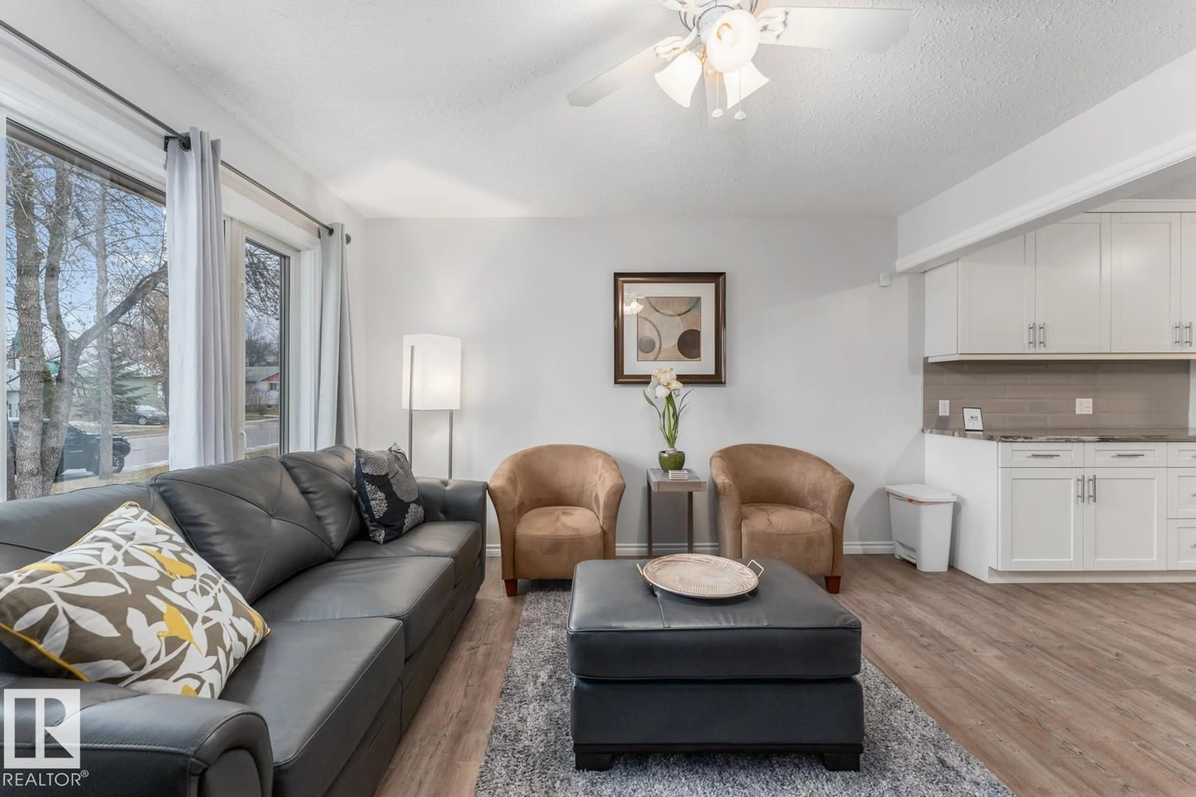 Living room with furniture, wood/laminate floor for 5210 51 AV, Bonnyville Town Alberta T9N2A8