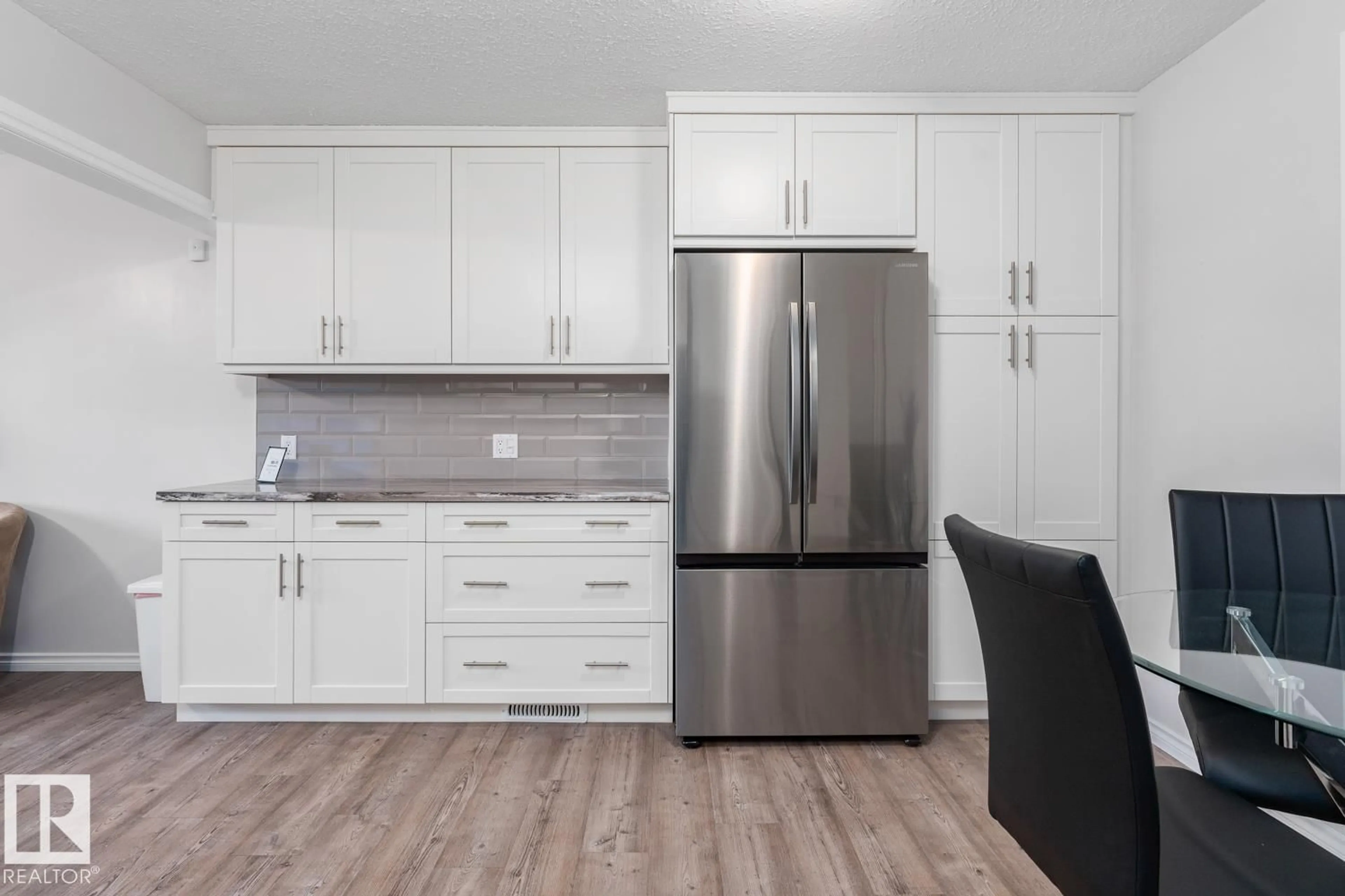 Open concept kitchen, wood/laminate floor for 5210 51 AV, Bonnyville Town Alberta T9N2A8
