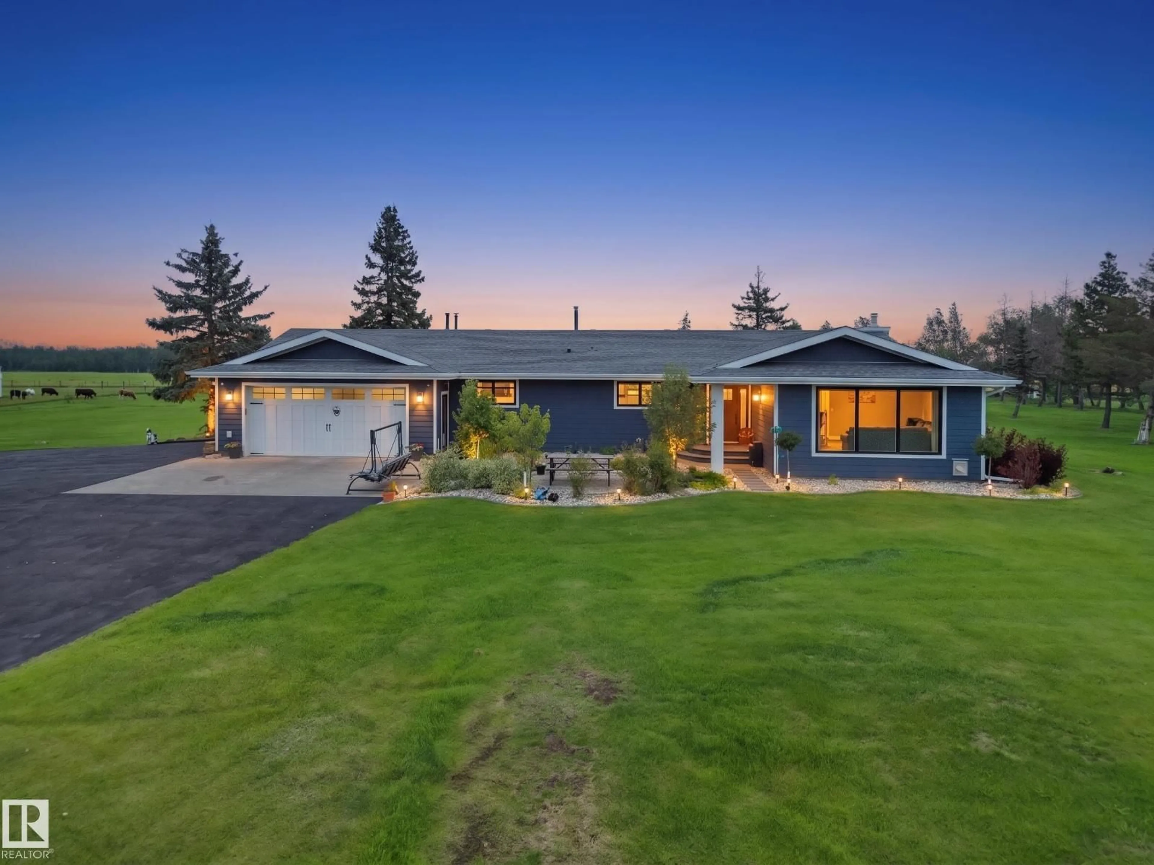 A pic from outside/outdoor area/front of a property/back of a property/a pic from drone, street for 1150-50242 RGE RD 244A, Rural Leduc County Alberta T4X0P4