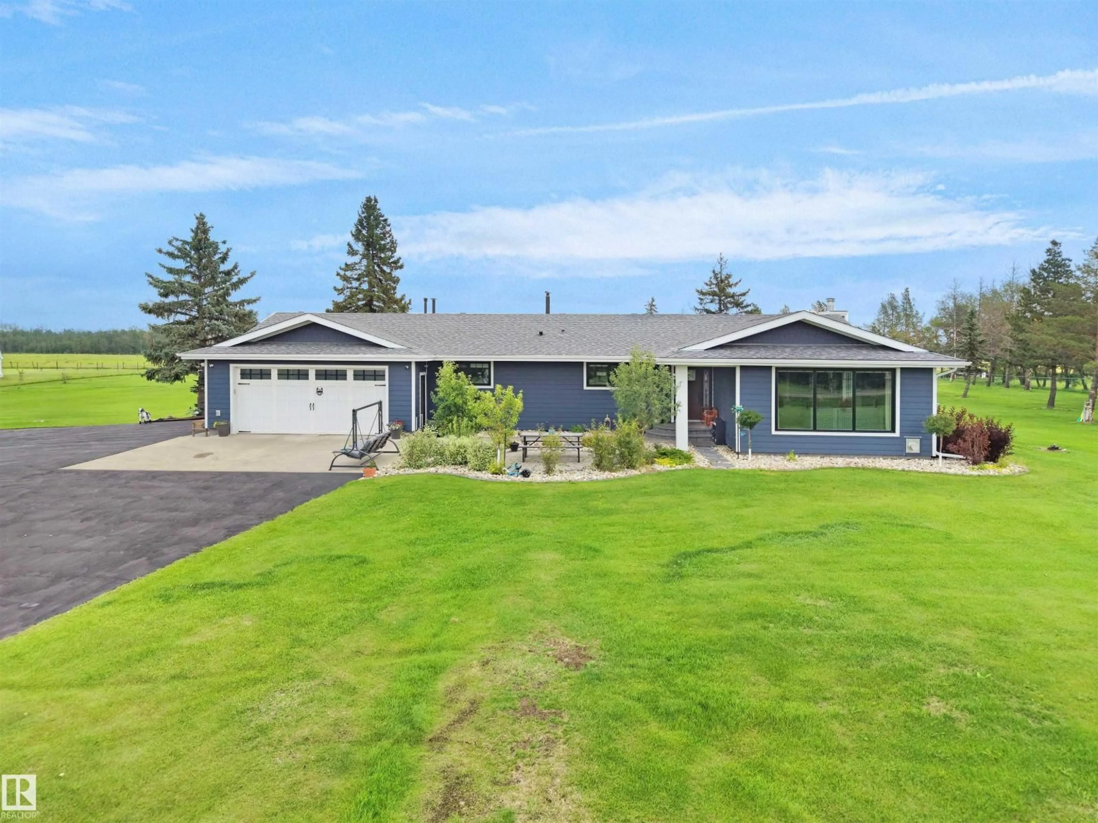 A pic from outside/outdoor area/front of a property/back of a property/a pic from drone, unknown for 1150-50242 RGE RD 244A, Rural Leduc County Alberta T4X0P4