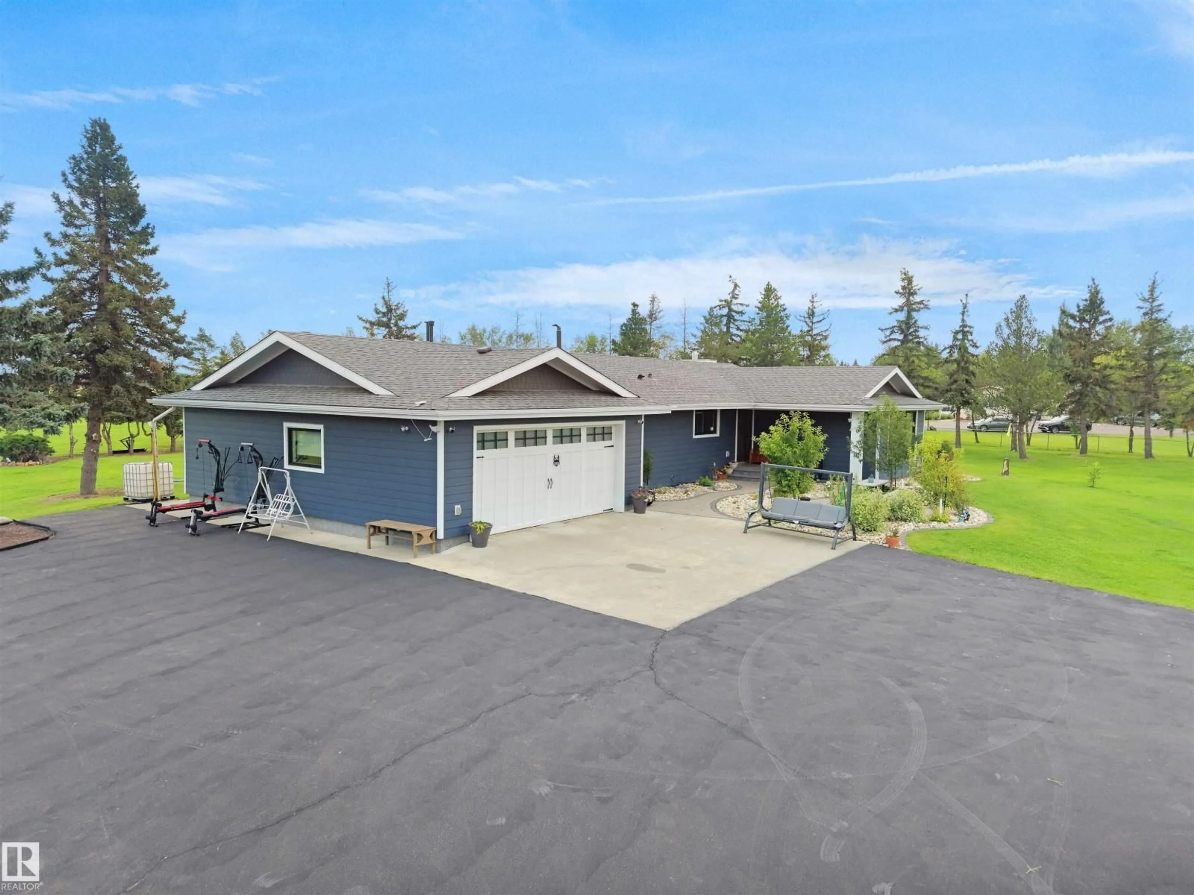 A pic from outside/outdoor area/front of a property/back of a property/a pic from drone, unknown for 1150-50242 RGE RD 244A, Rural Leduc County Alberta T4X0P4
