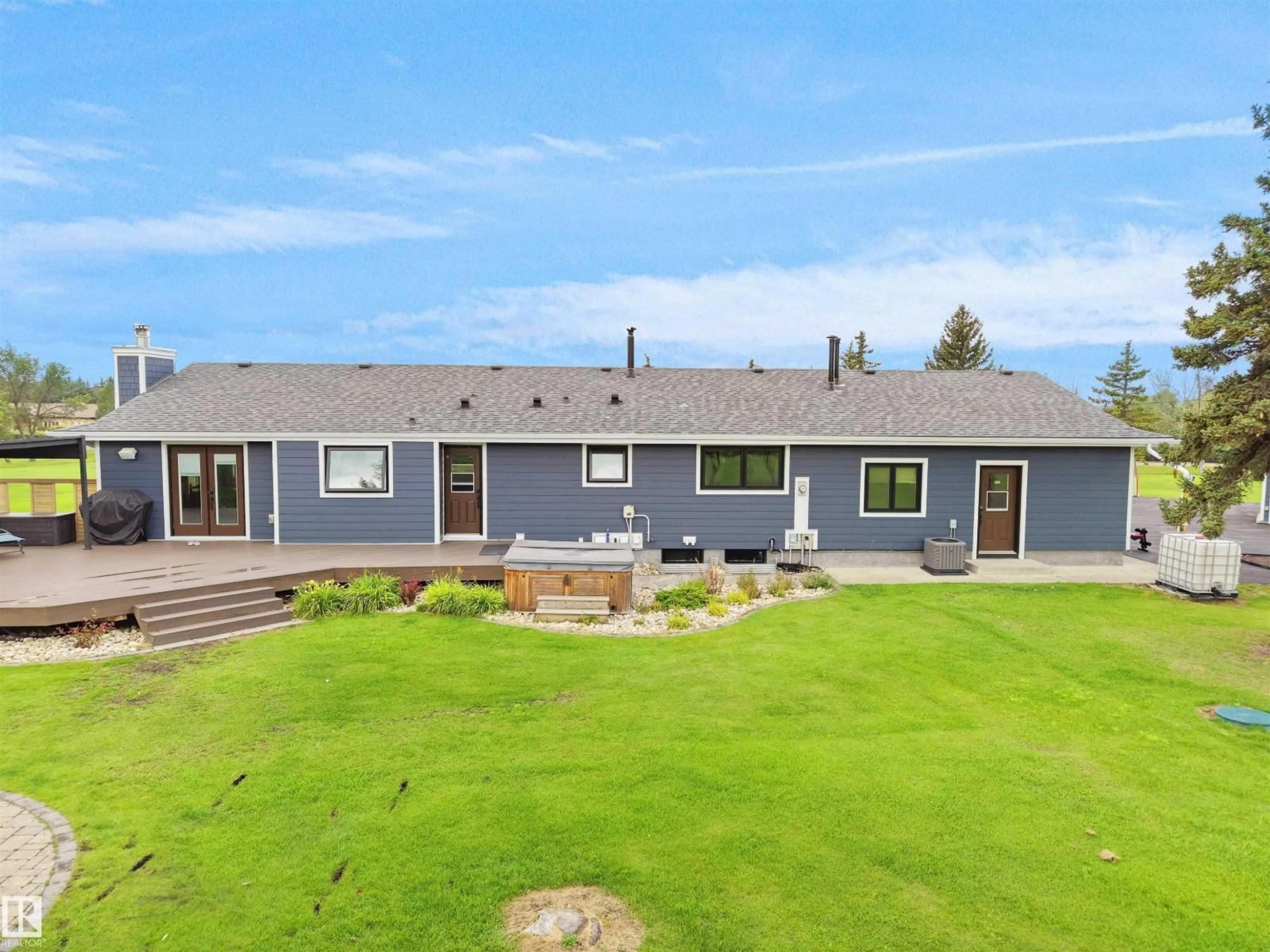 A pic from outside/outdoor area/front of a property/back of a property/a pic from drone, mountain view for 1150-50242 RGE RD 244A, Rural Leduc County Alberta T4X0P4