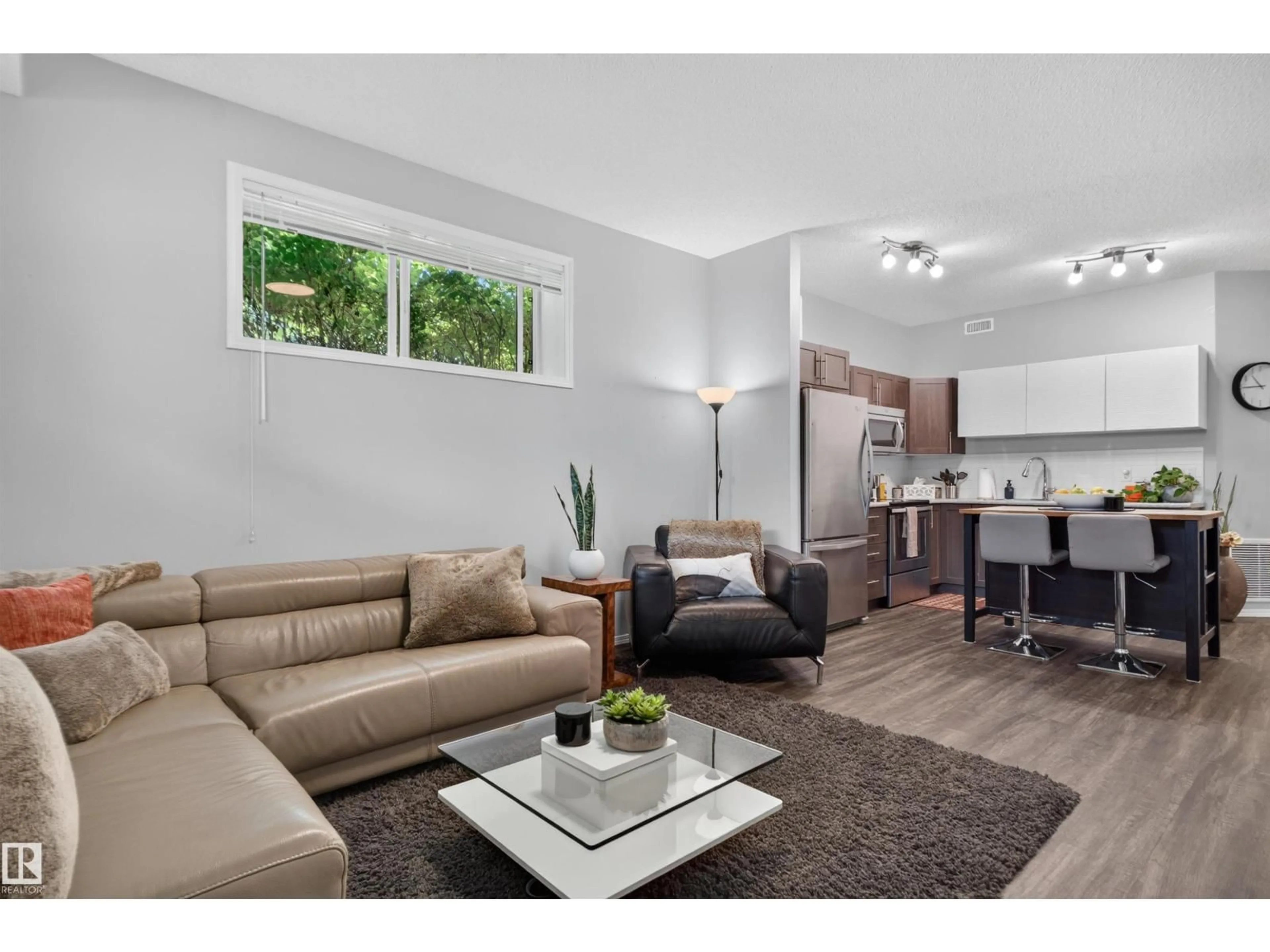 Living room with furniture, wood/laminate floor for #34 - 6520 2 AV, Edmonton Alberta T6X1S4