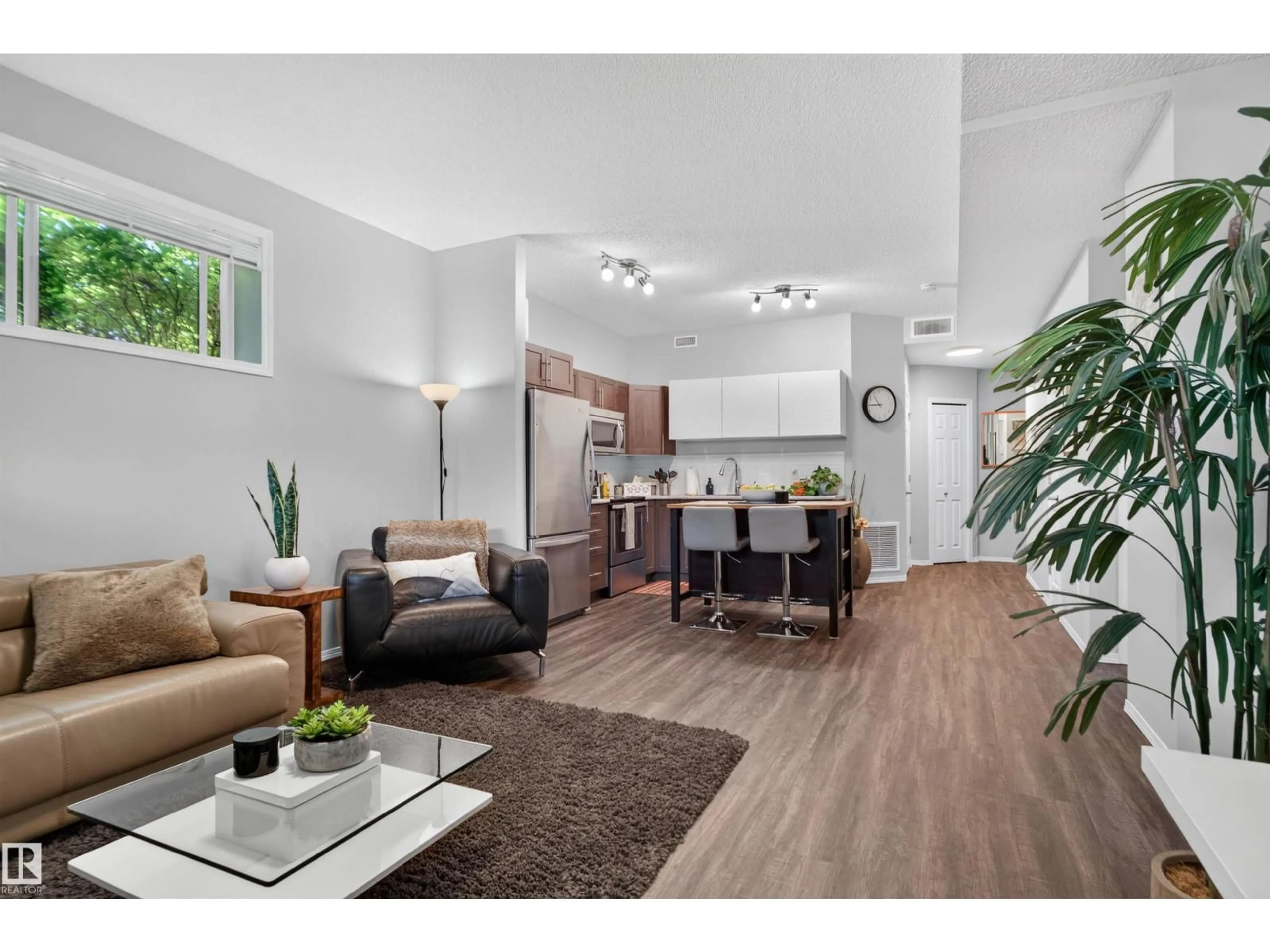 Living room with furniture, wood/laminate floor for #34 - 6520 2 AV, Edmonton Alberta T6X1S4