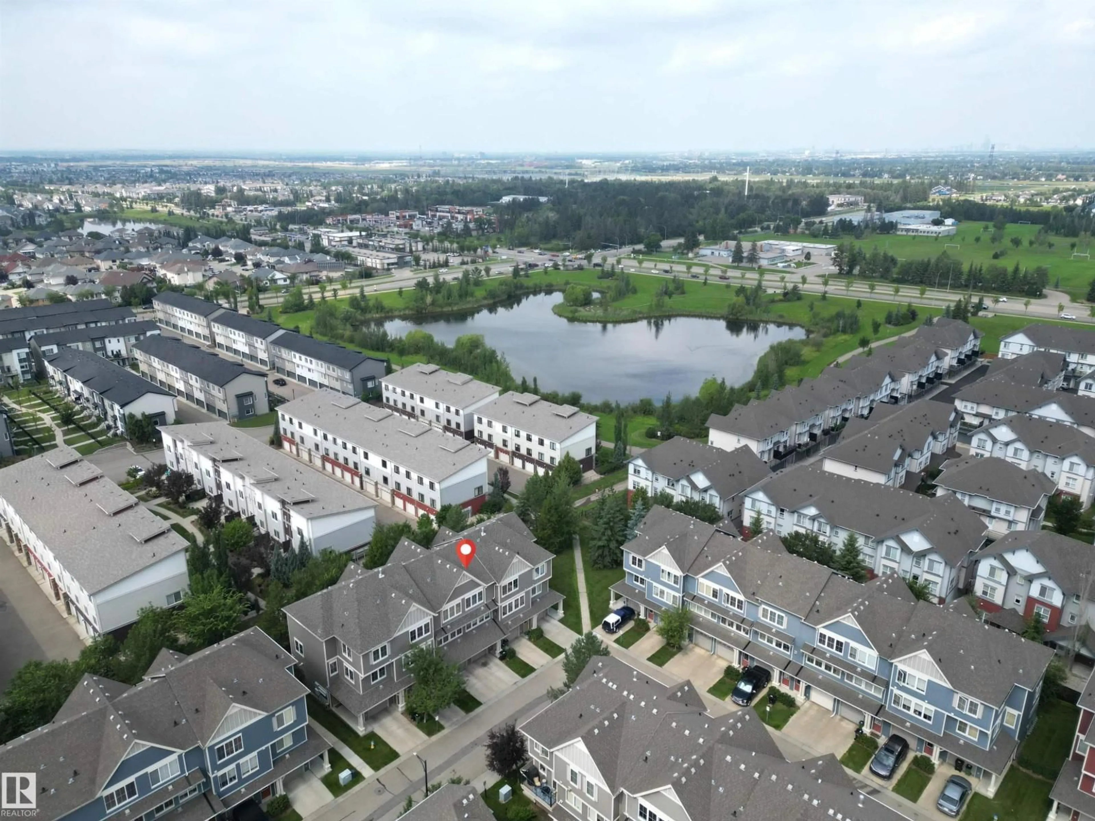 A pic from outside/outdoor area/front of a property/back of a property/a pic from drone, water/lake/river/ocean view for #61 - 603 WATT BV, Edmonton Alberta T6X0P3