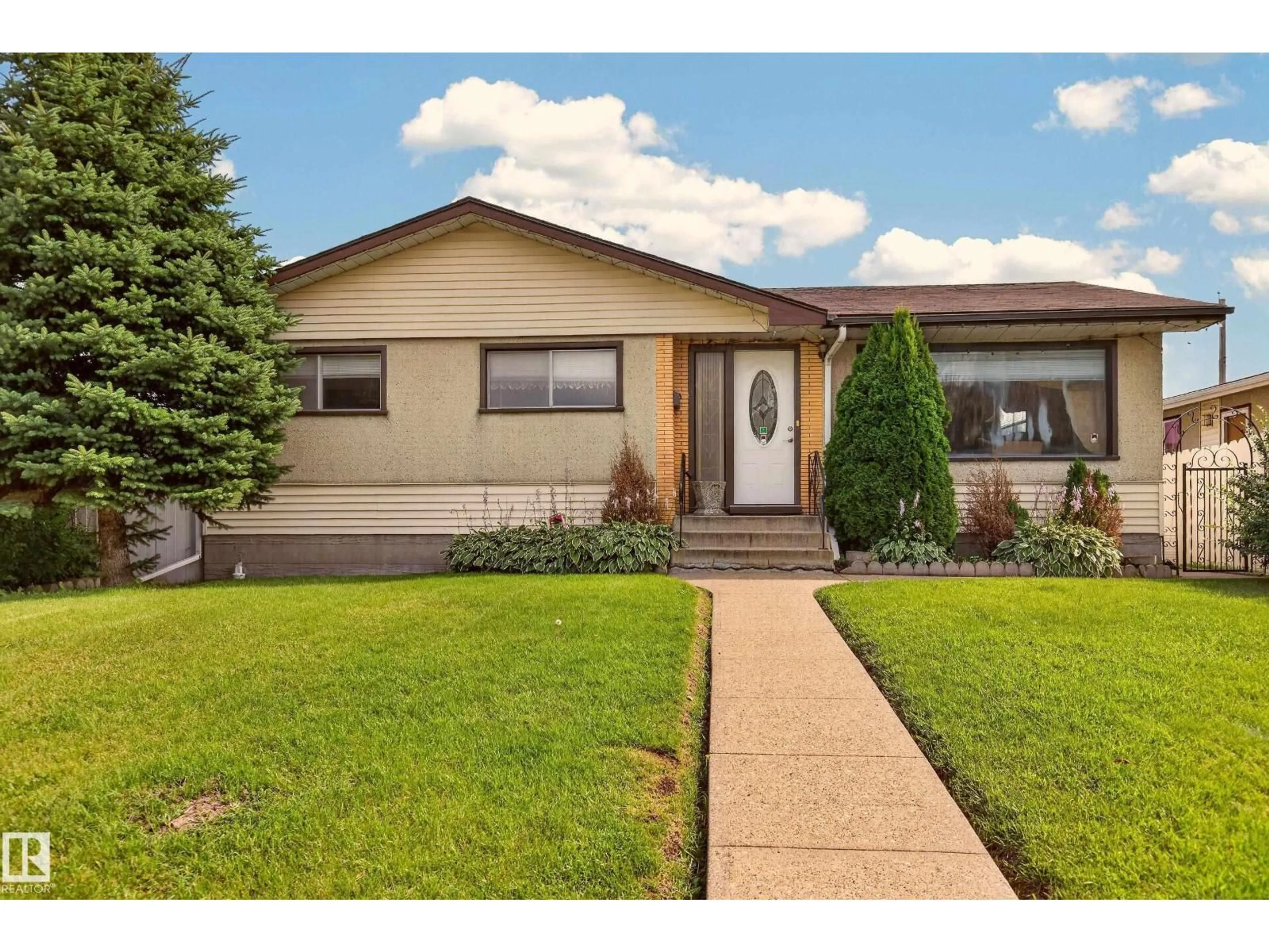 Home with vinyl exterior material, street for 8411 136 AV, Edmonton Alberta T5E1T9