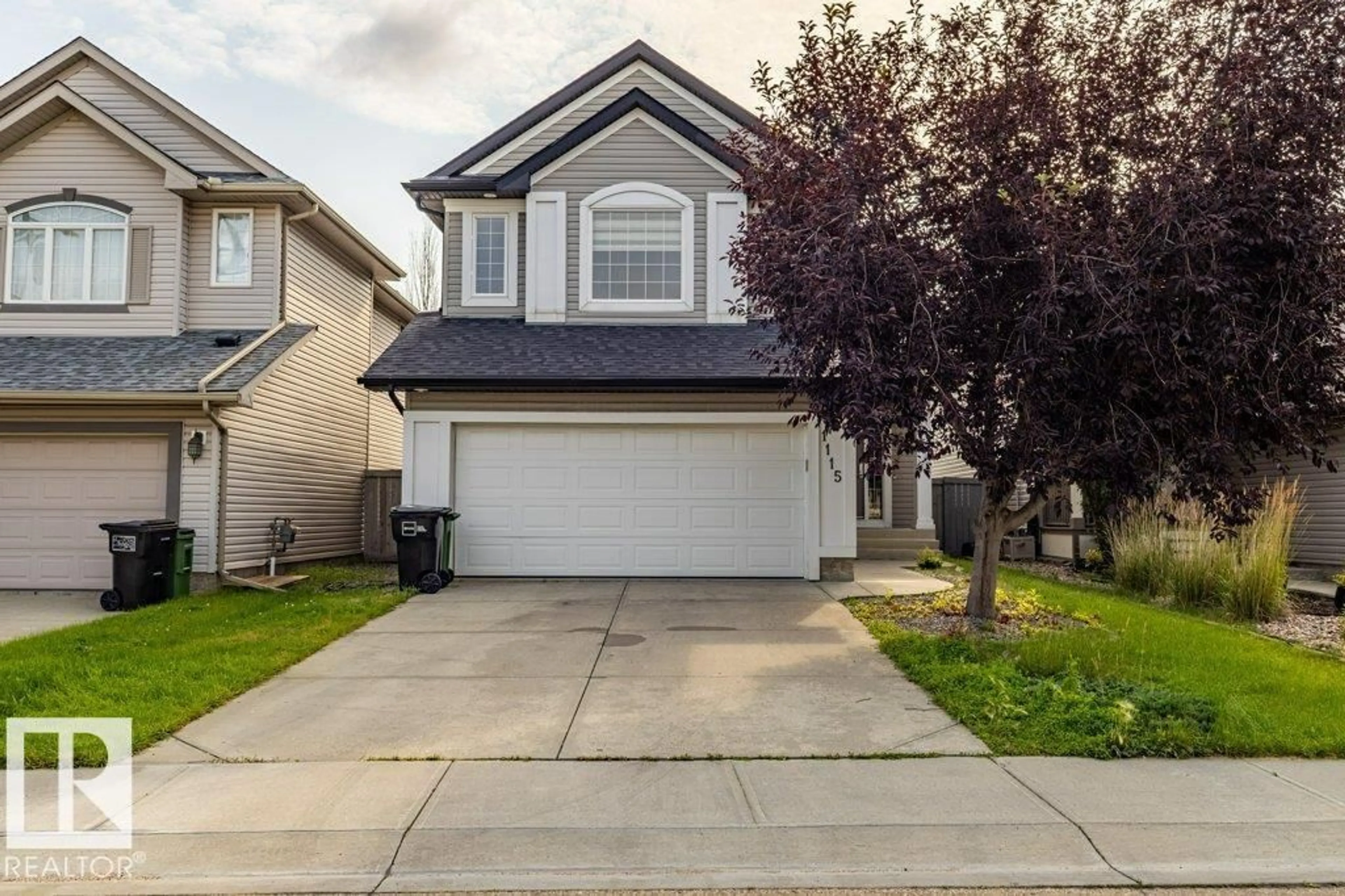 Home with vinyl exterior material, street for 1115 117A ST SW, Edmonton Alberta T6W0B9