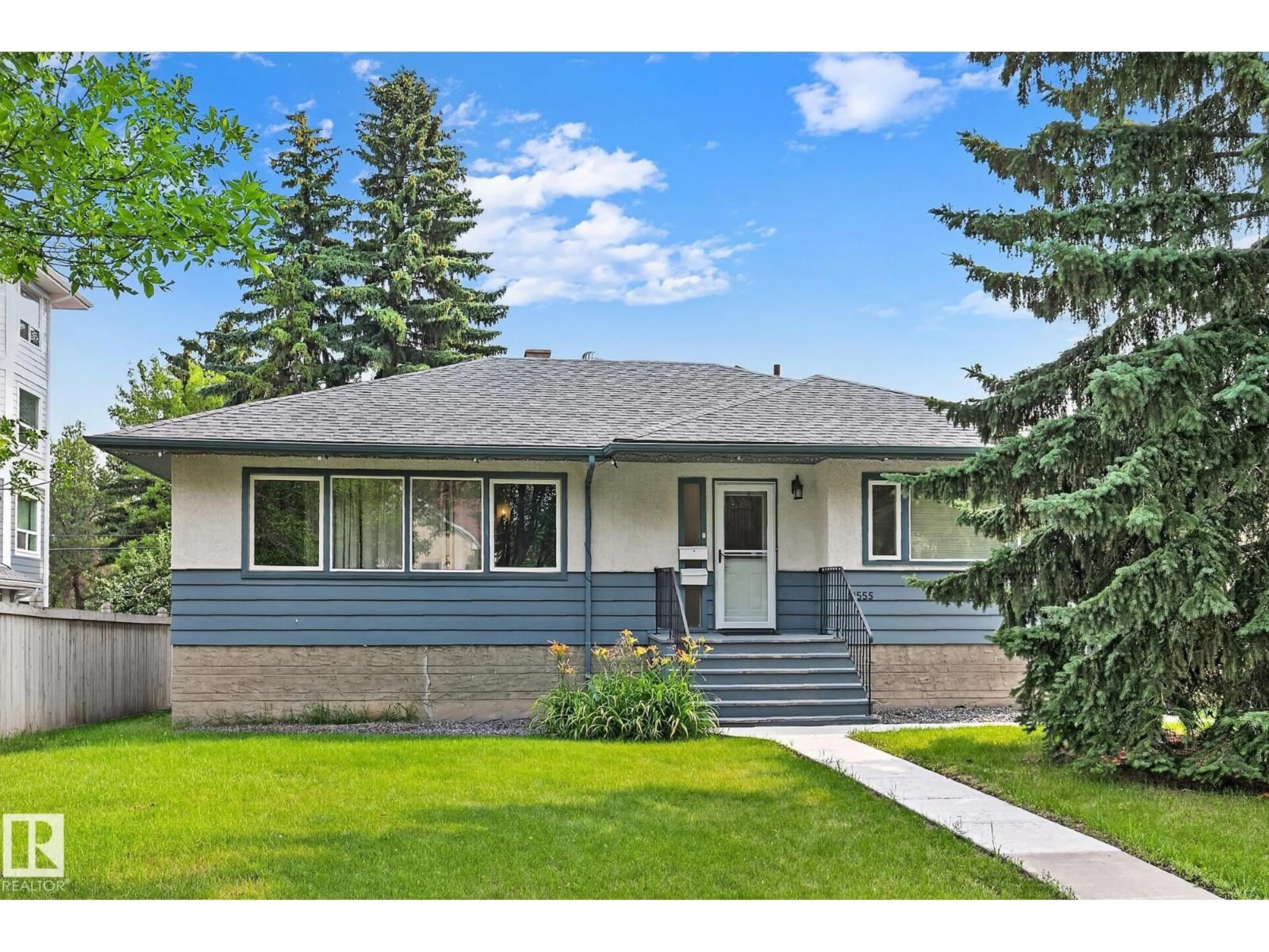 Home with vinyl exterior material, street for 11555 136 STREET, Edmonton Alberta T5M1M4